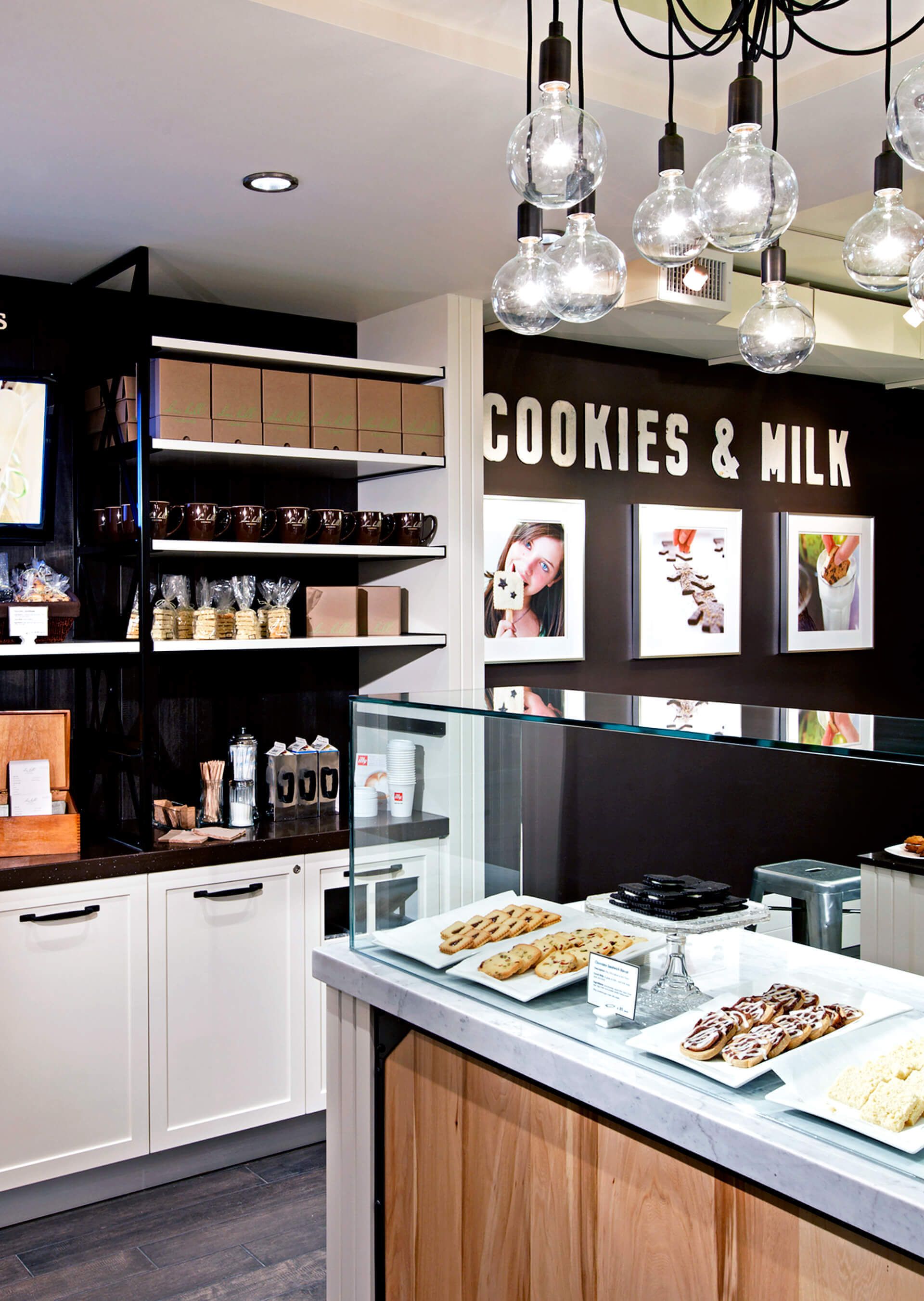 A kitchen with a sign that says cookies and milk