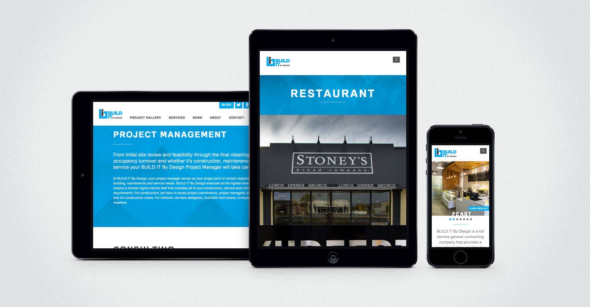 A tablet a phone and a tablet with a restaurant website on them