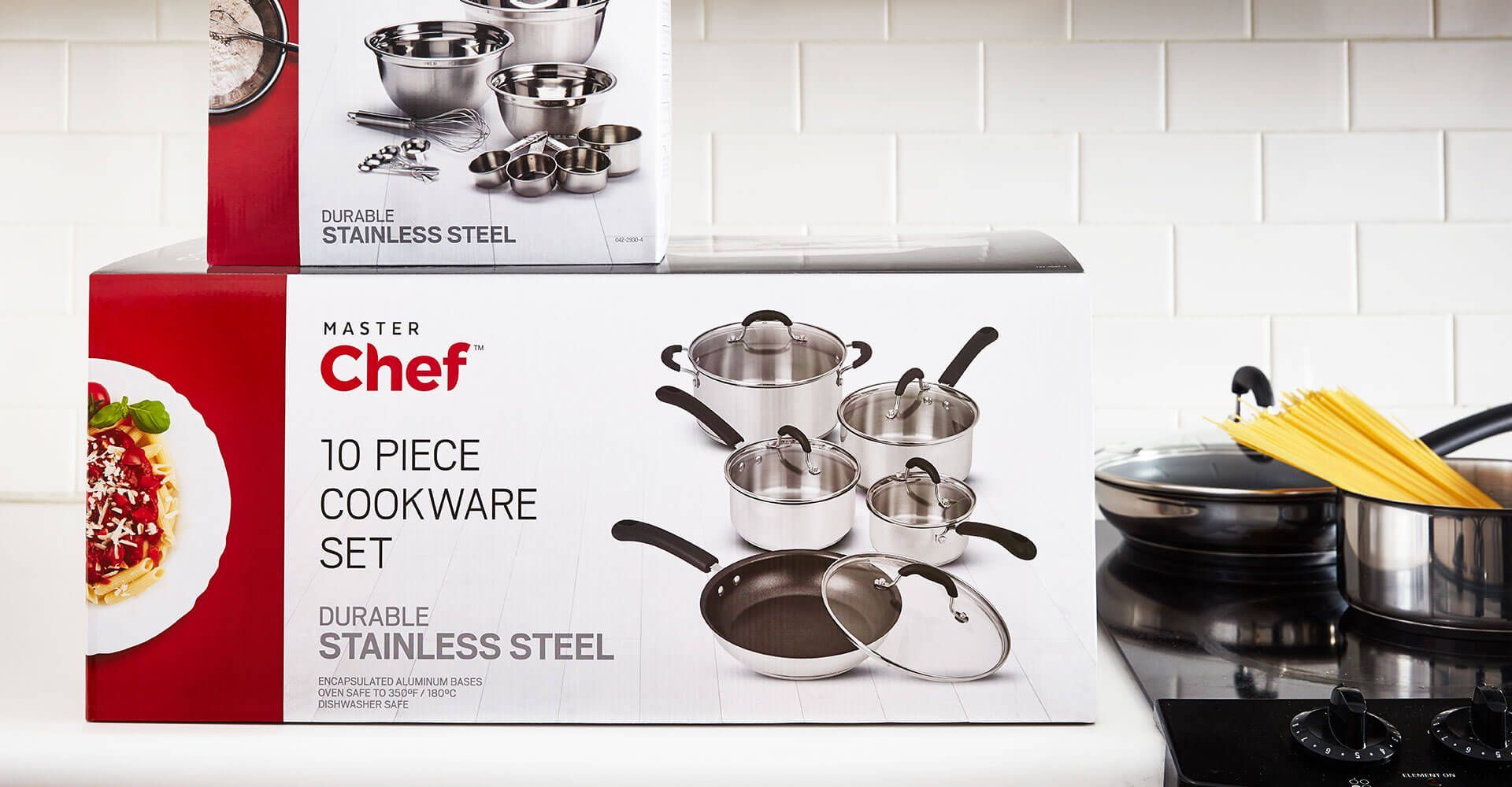 A chef 10 piece cookware set is sitting on top of a stove.