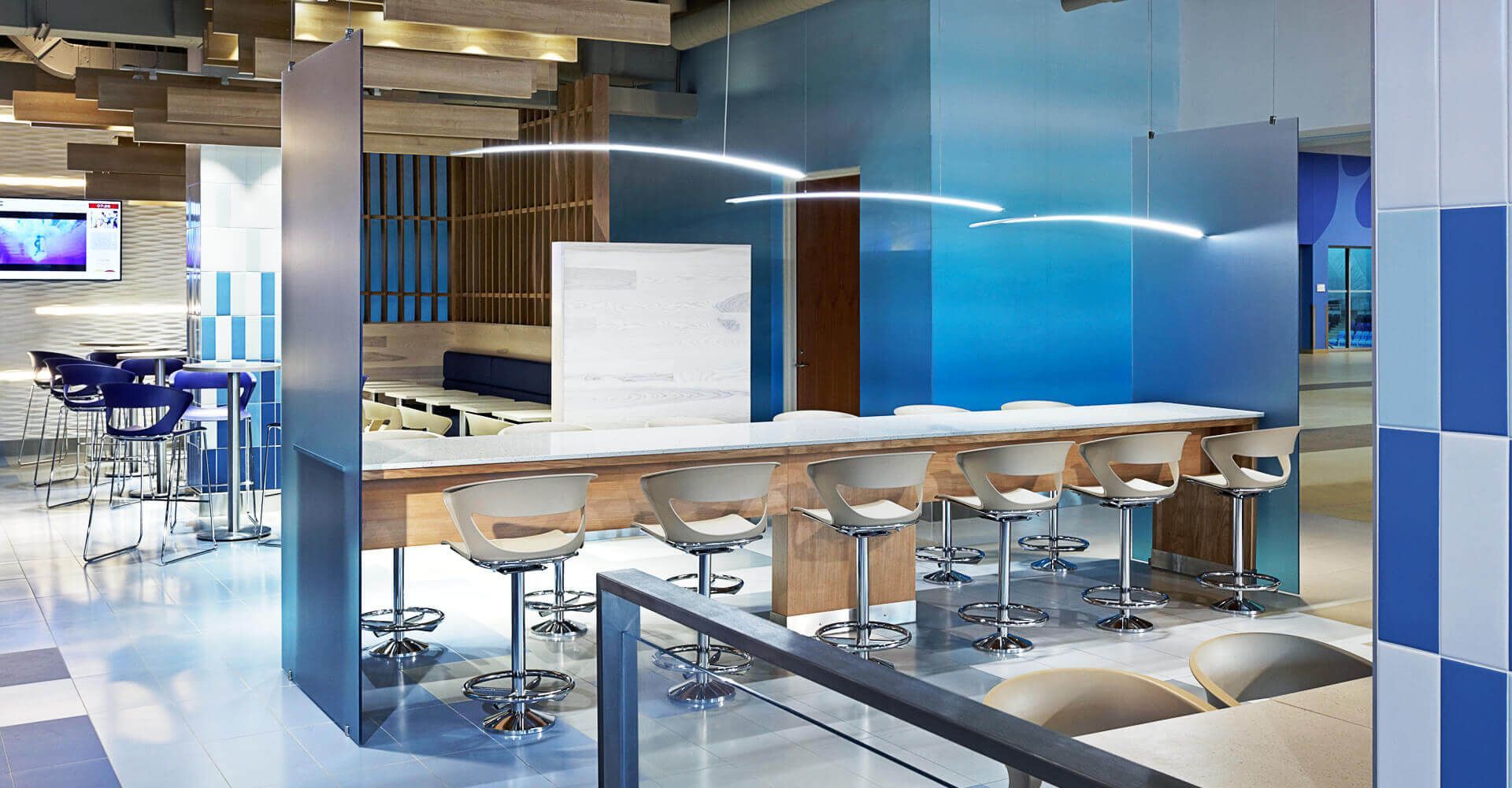 A blue and white room with tables and chairs