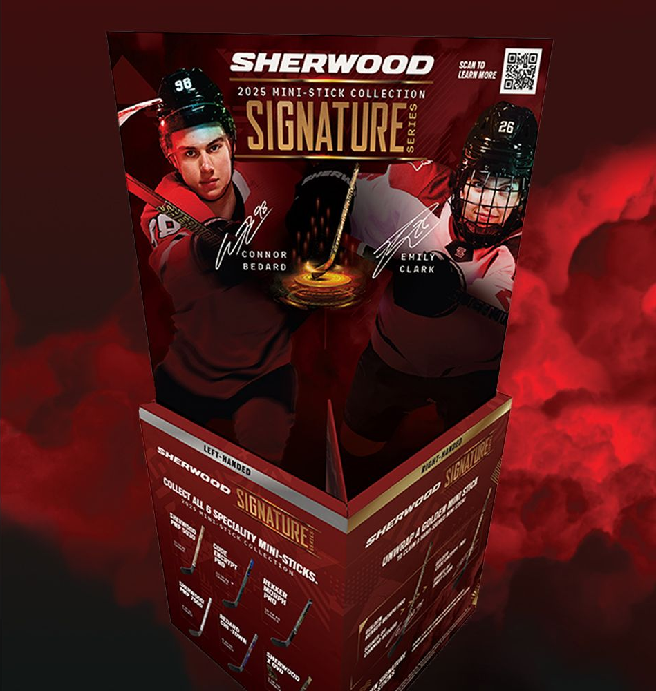 A bowl of sauce surrounded by garlic , lemongrass , onions , and red pepper.