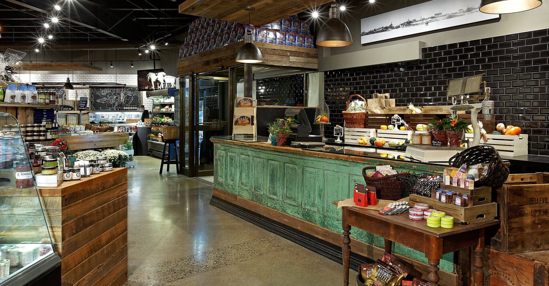 A restaurant with a green counter and a wooden table.