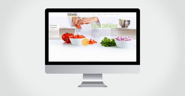 A computer monitor with a picture of vegetables on it
