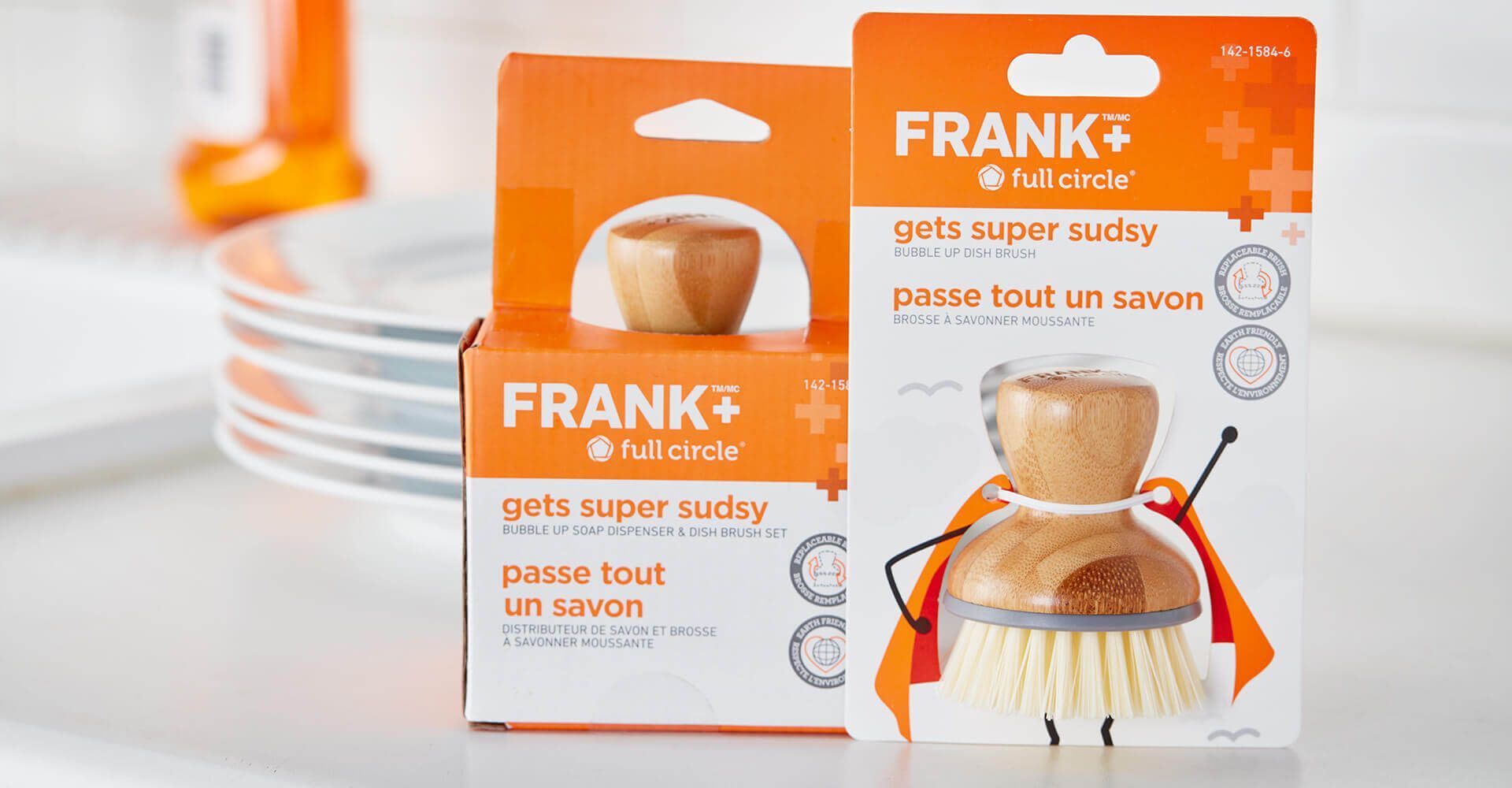 Two boxes of frank 's dish brushes are sitting on a table.