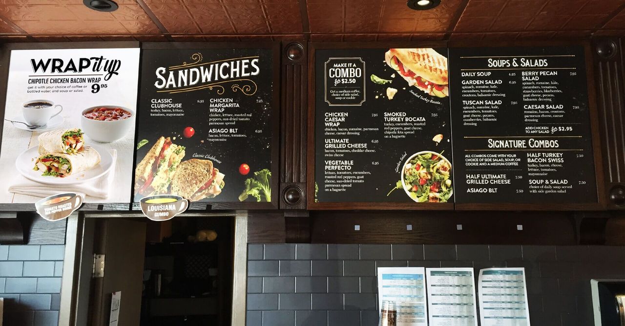 A restaurant with a menu that says sandwiches on it.