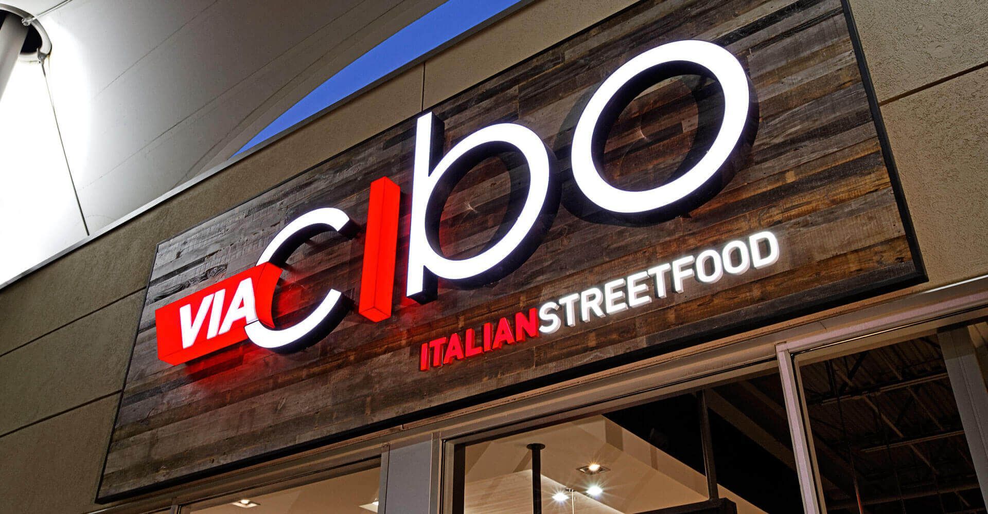 A sign for a restaurant called via cibo italian street food.