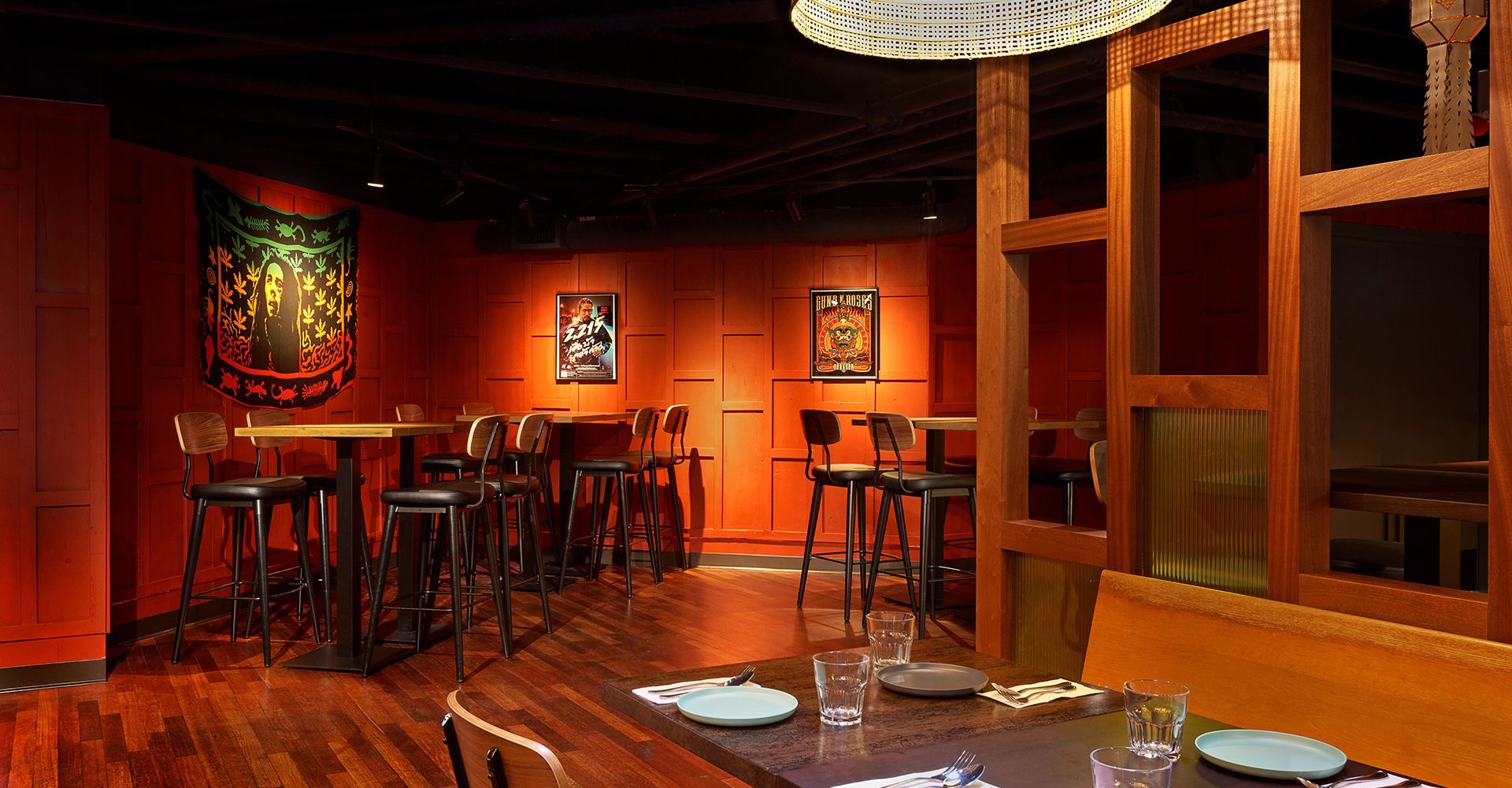 A restaurant filled with tables and chairs and a couch.