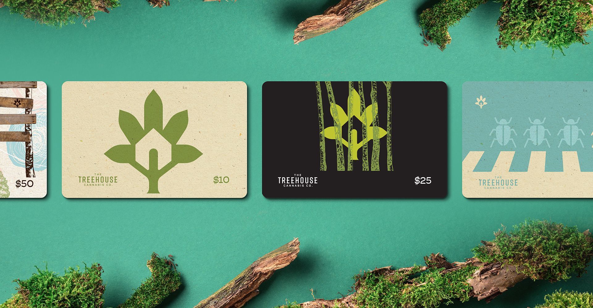 A group of cards are sitting on top of each other on a green surface.