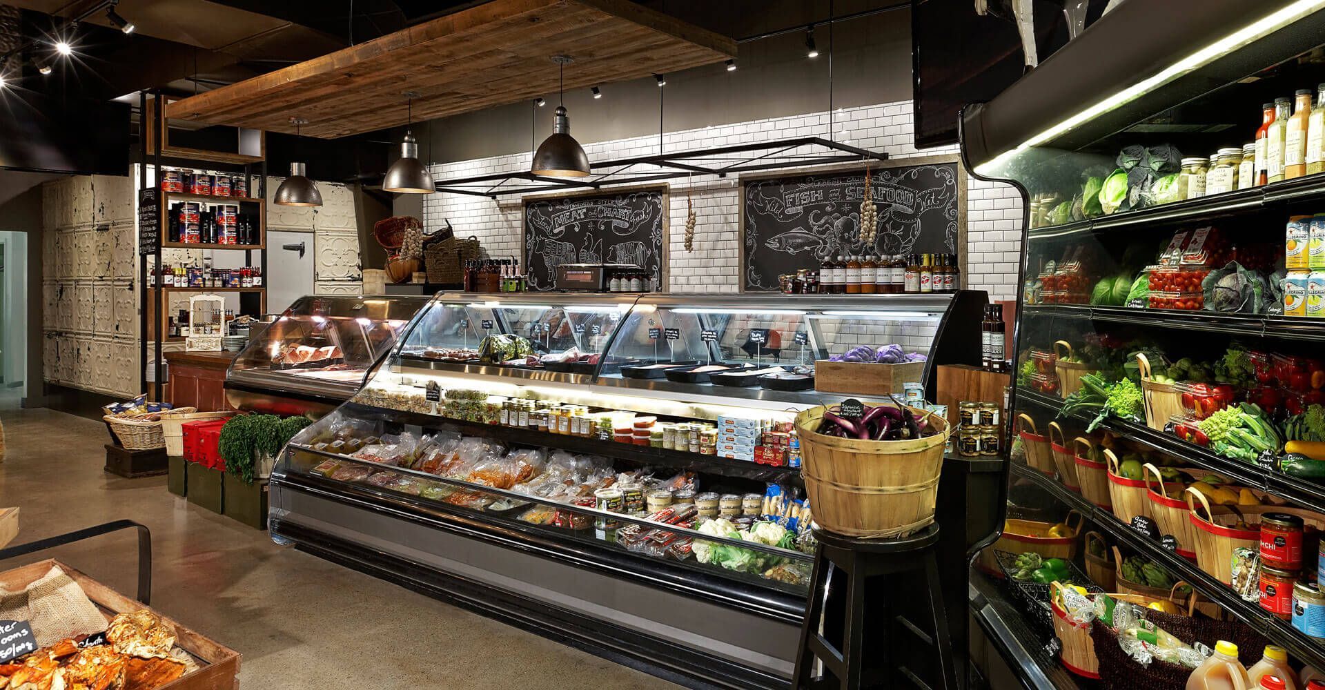 A grocery store filled with lots of food and vegetables.