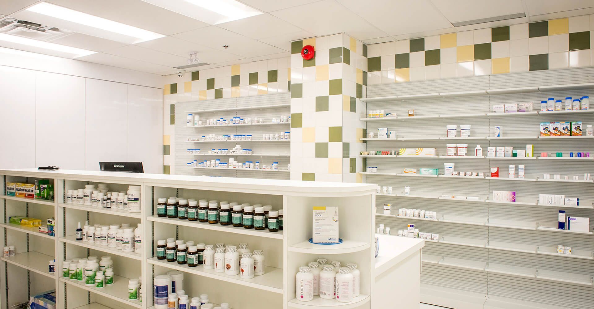A pharmacy with lots of shelves filled with lots of medications.