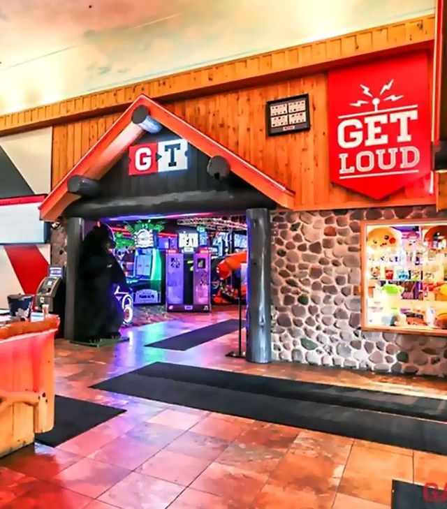 A restaurant with a sign that says get loud