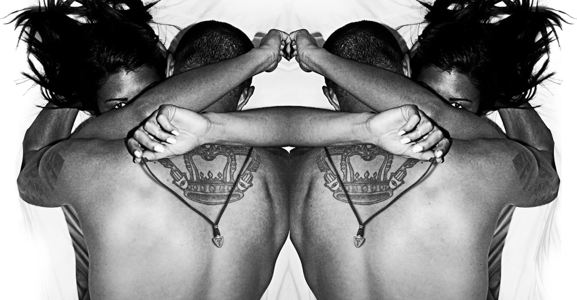 A black and white photo of two people hugging each other
