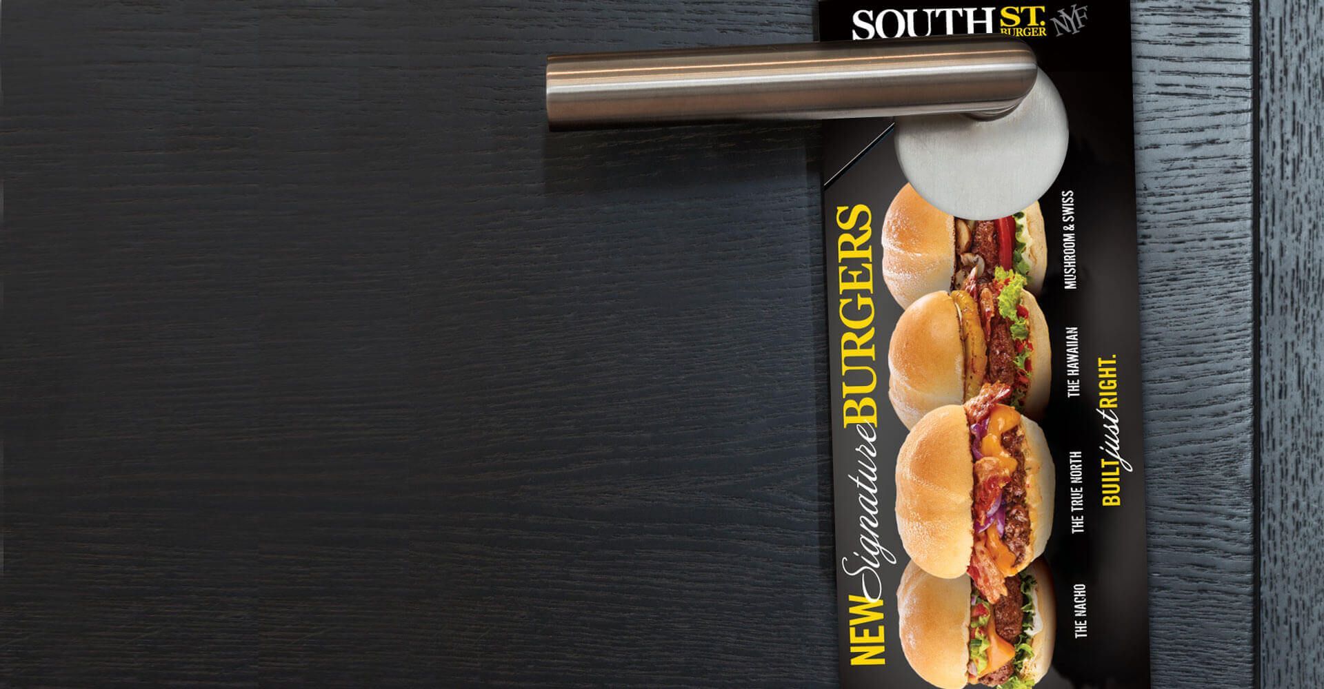 A door hanger with a picture of hamburgers on it