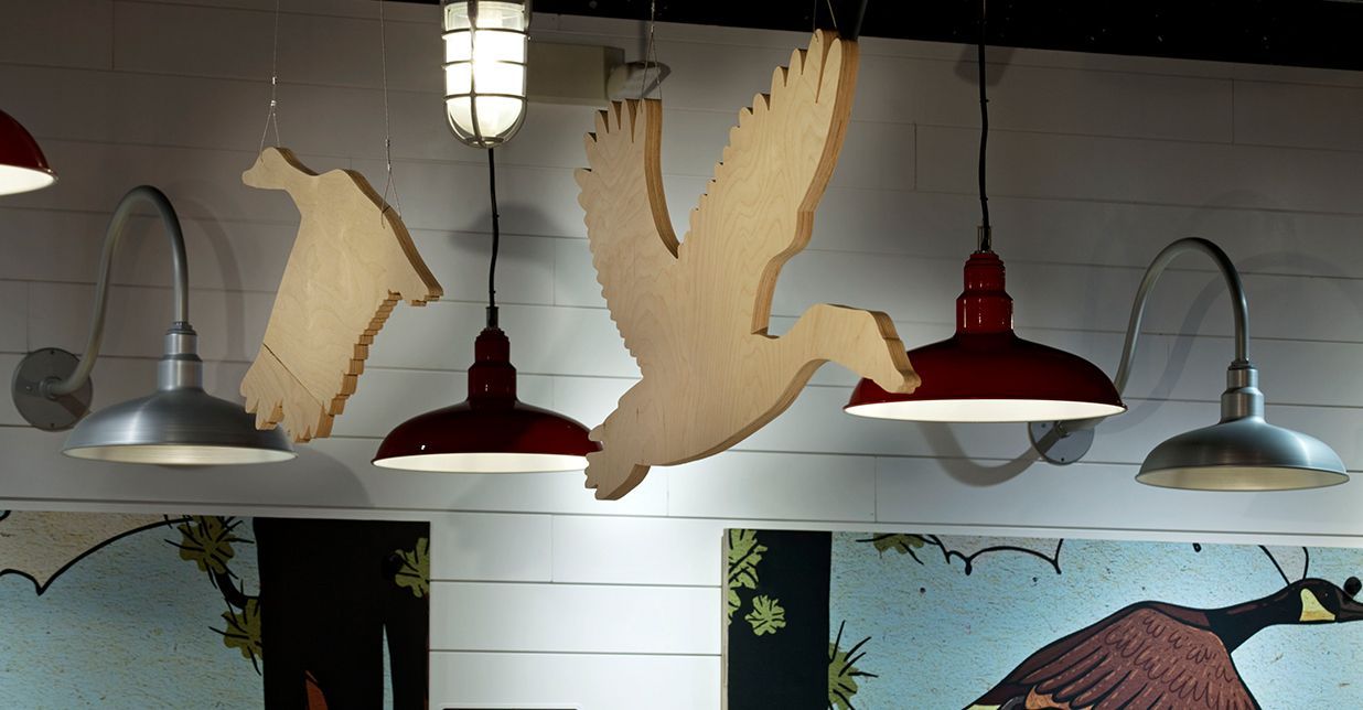 A bunch of hanging lights with birds on them