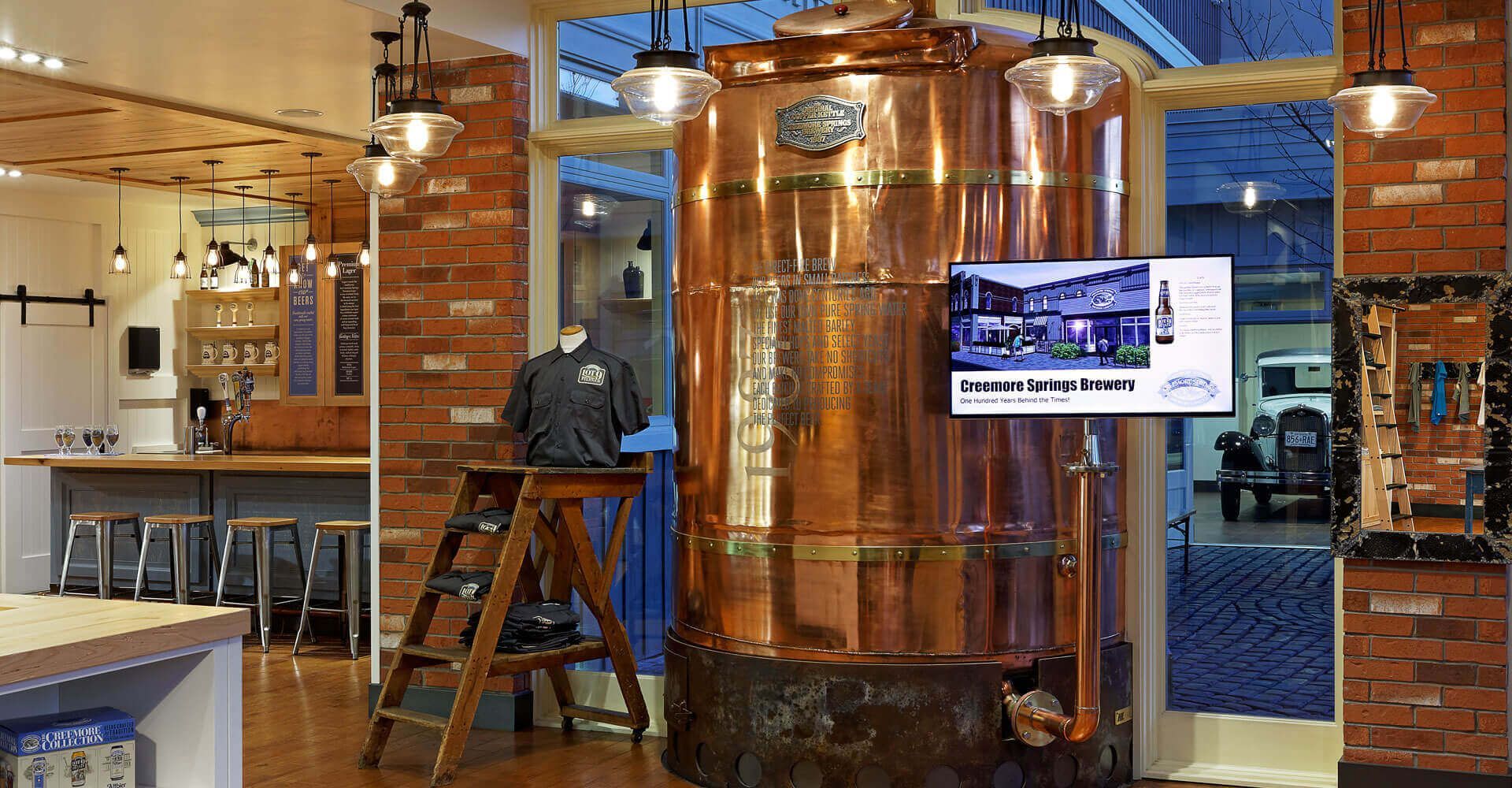 There is a large copper barrel in the middle of the room.