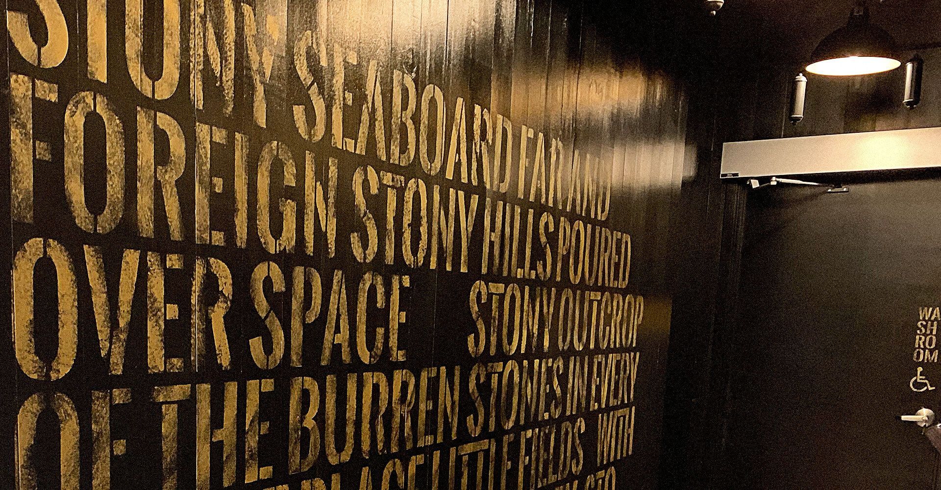 A wall with foreign story written on it