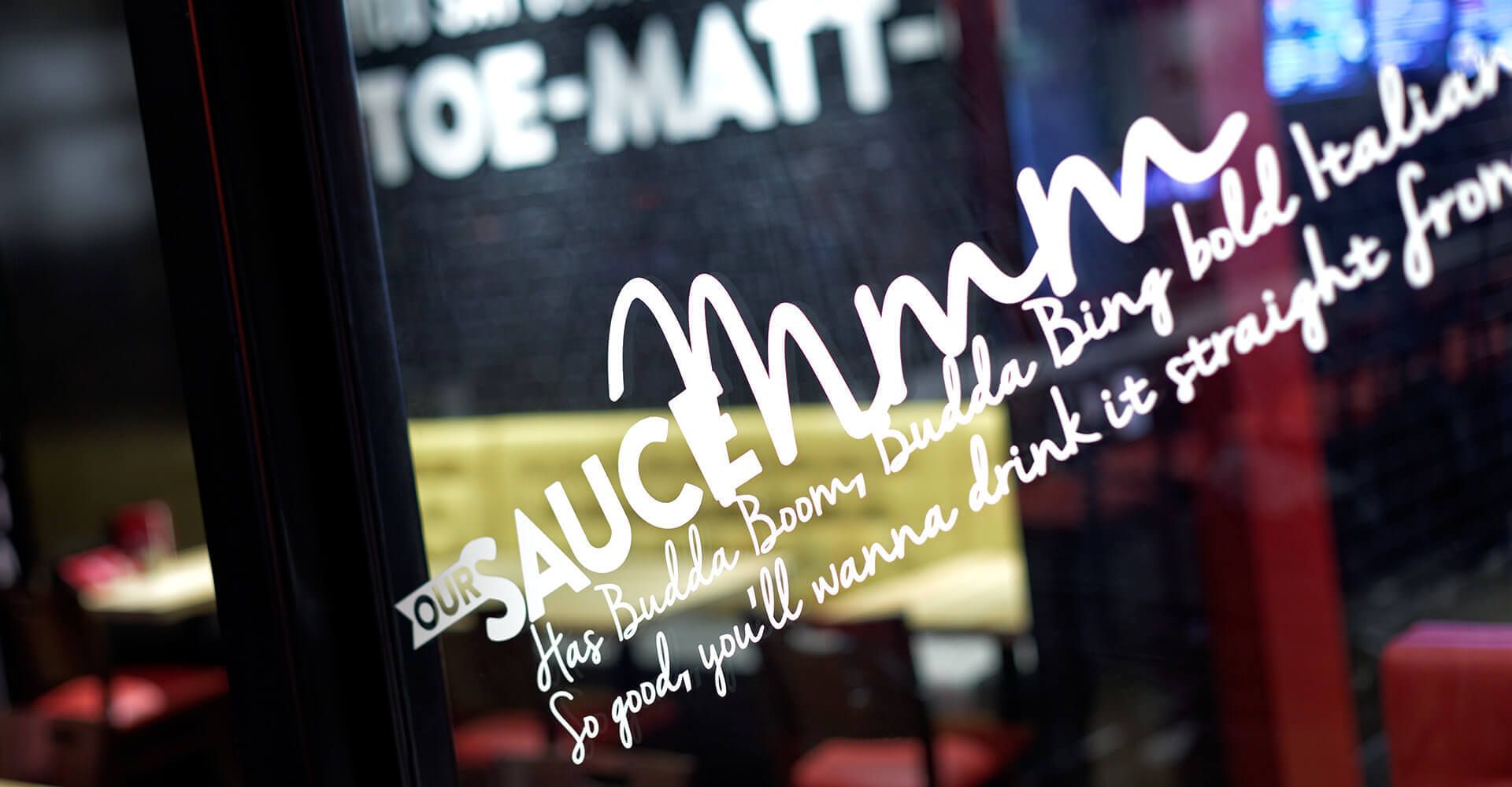 A close up of a sign that says sauce mommy