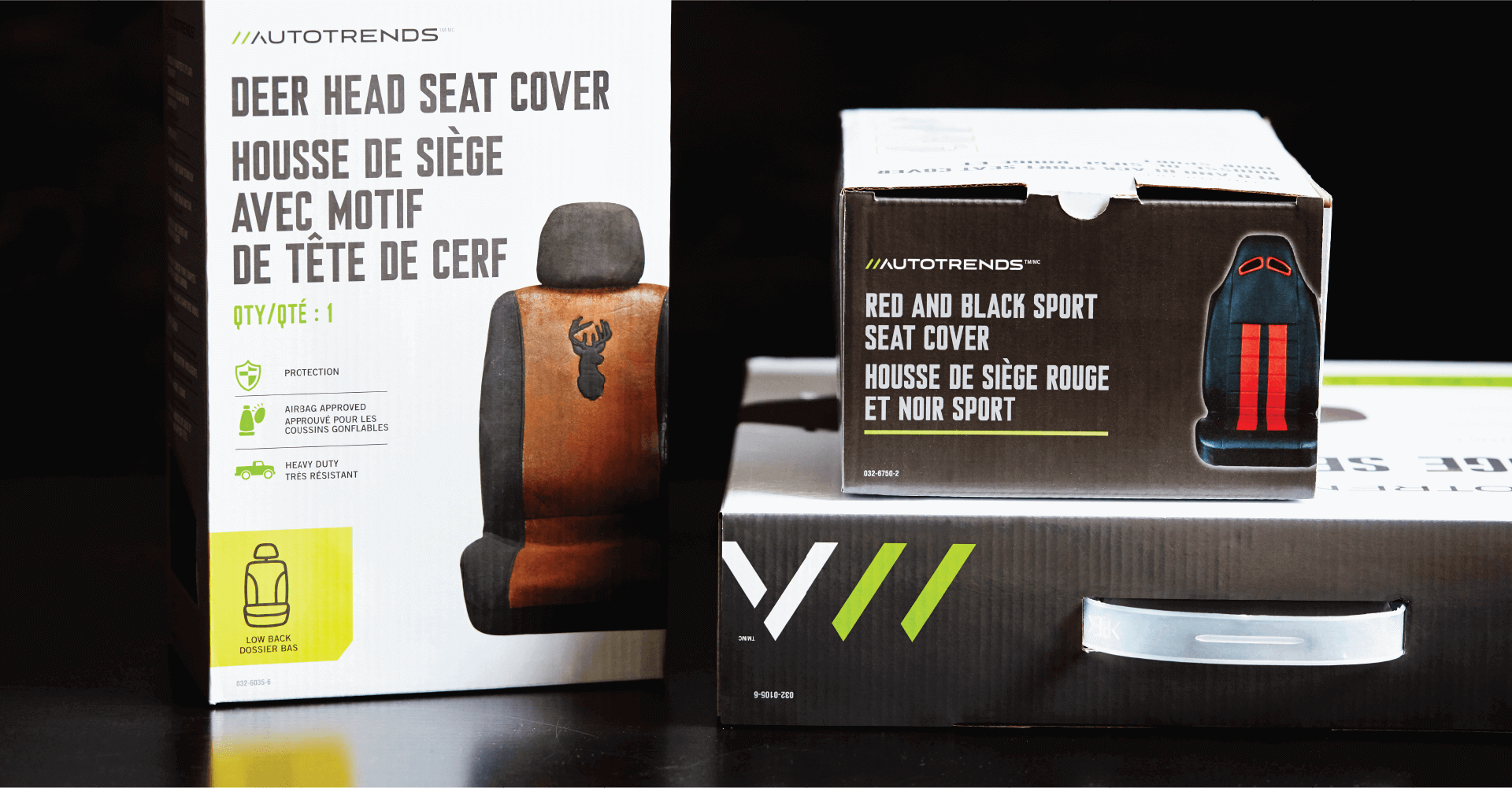 Two boxes of deer head seat covers are stacked on top of each other on a table.