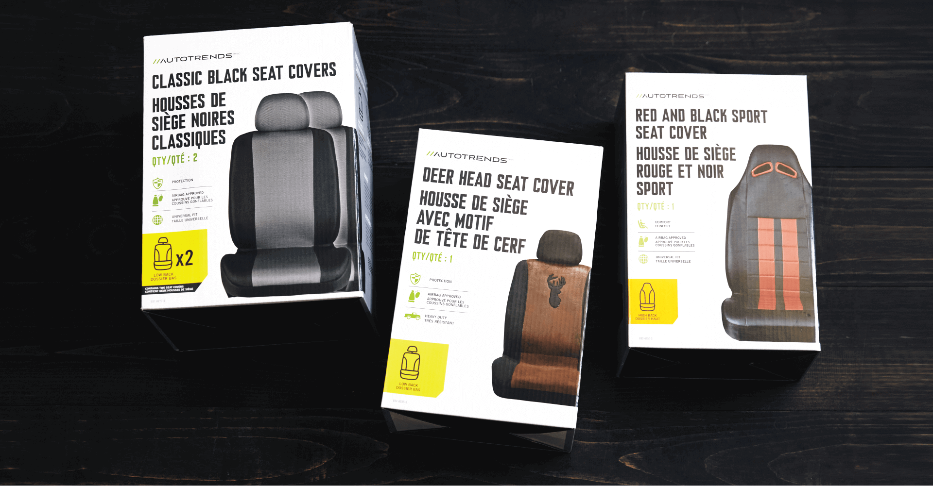 Three boxes of seat covers are sitting on a table