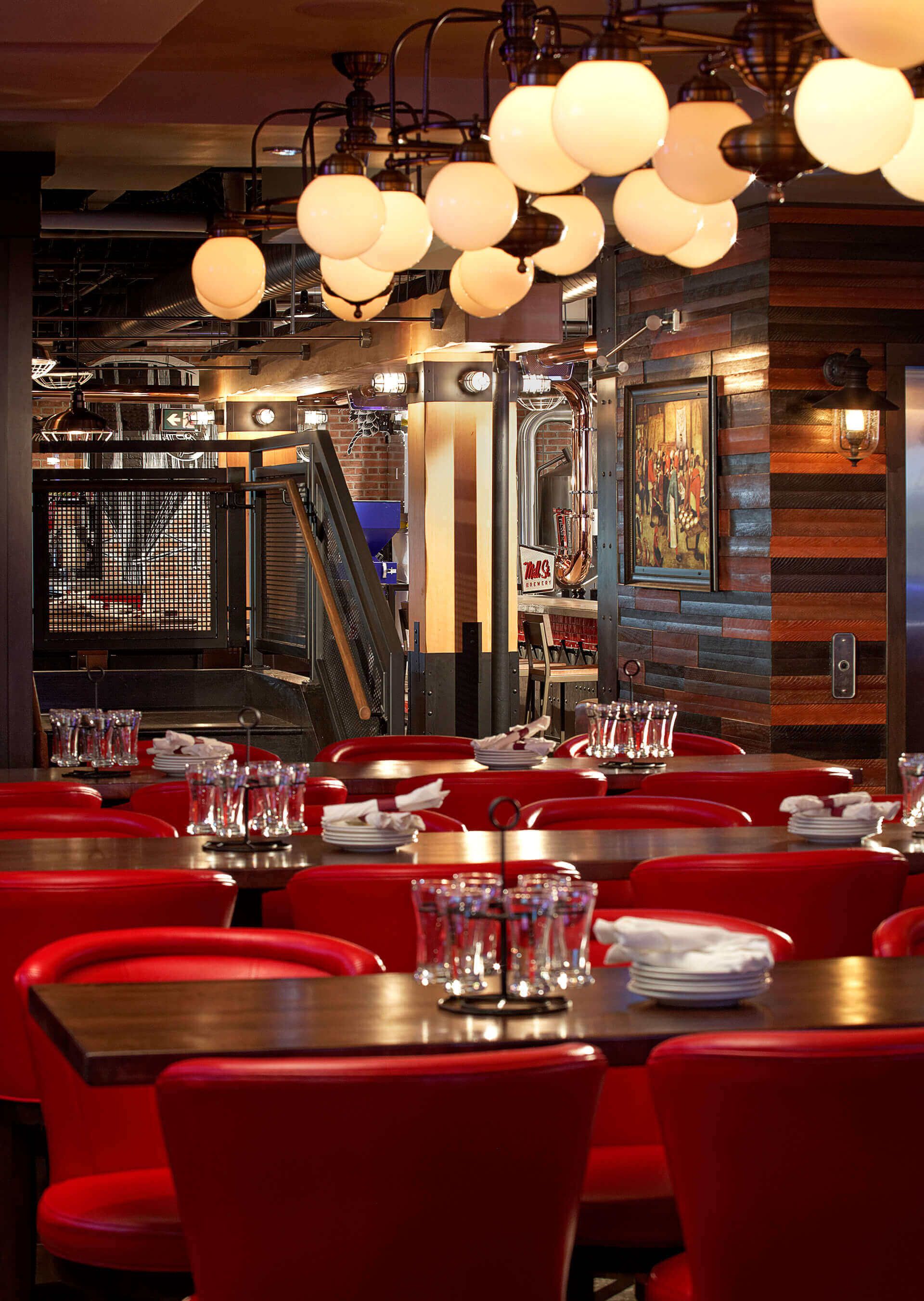 A restaurant with a lot of tables and chairs