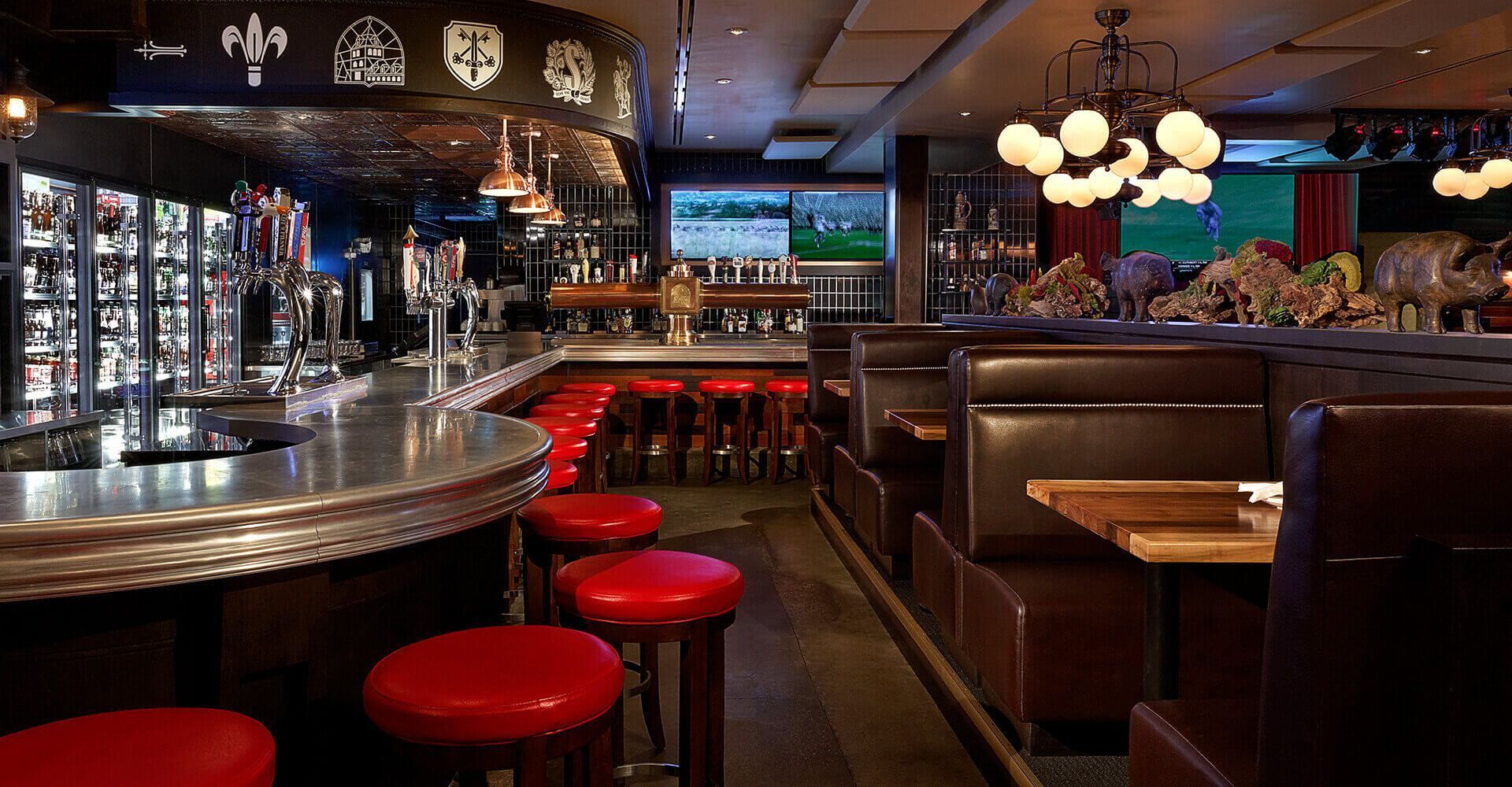 A restaurant with tables and stools and a bar