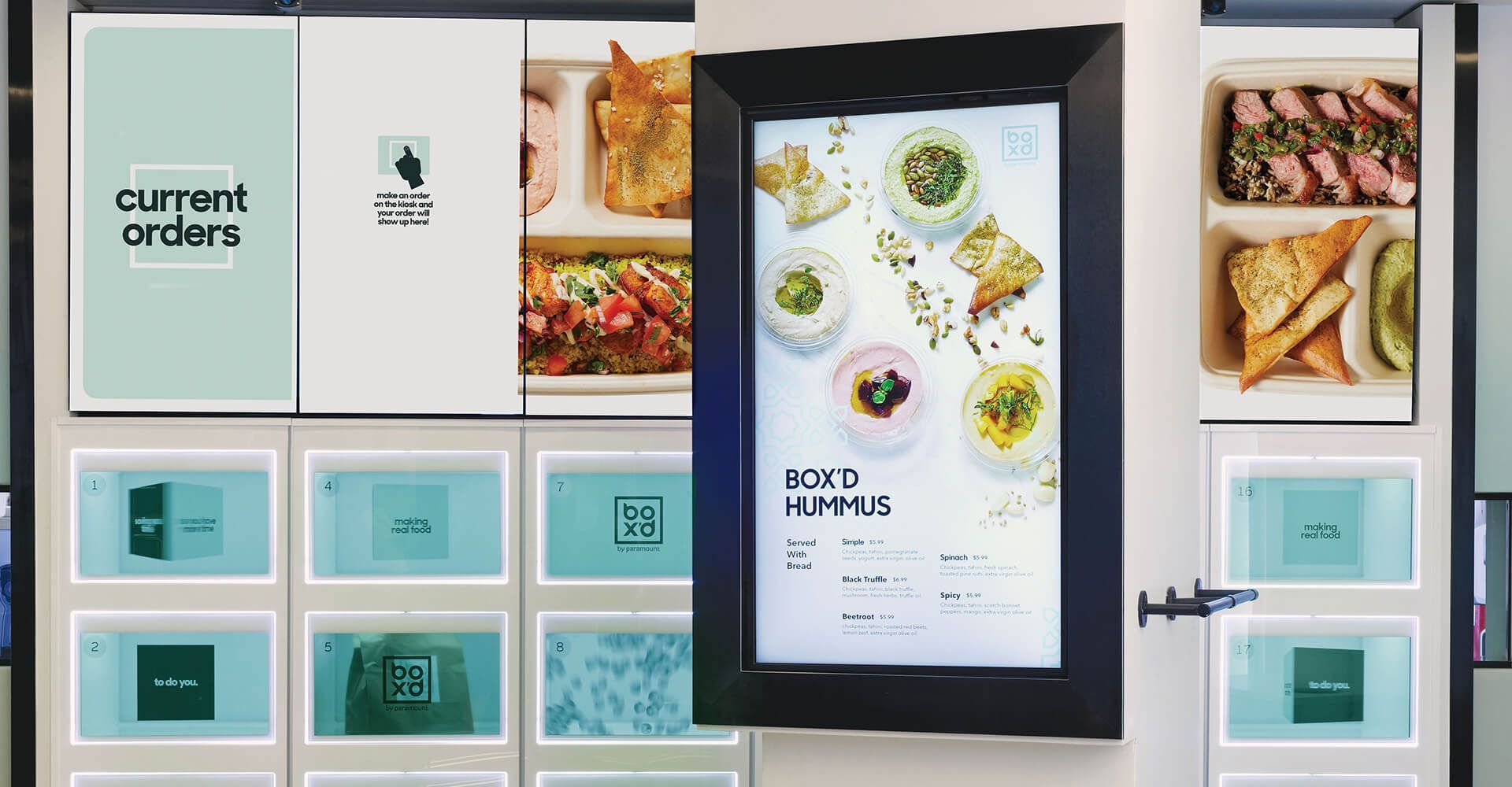 A wall with a picture of food on it and a sign that says current orders.