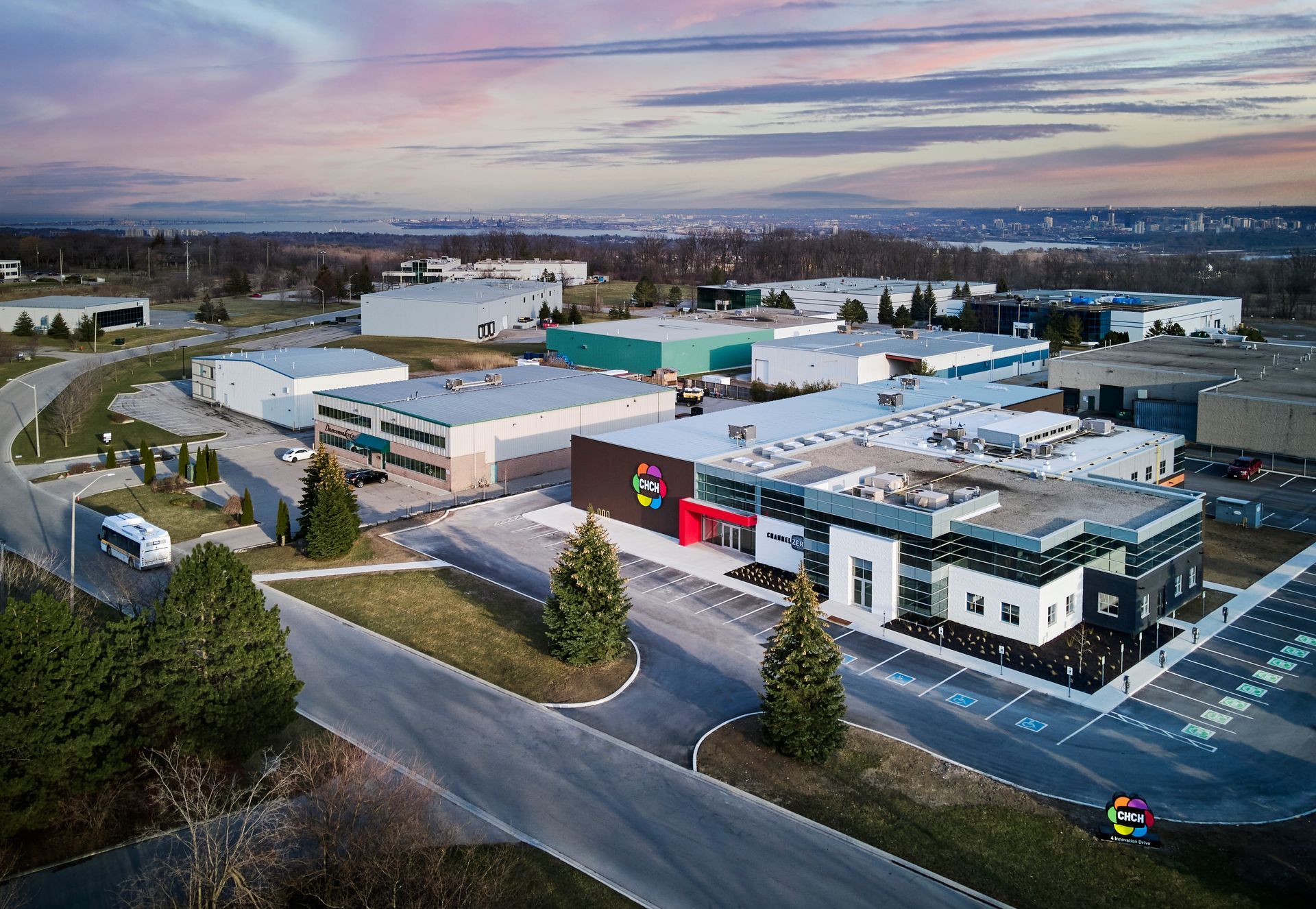 An aerial view of a large industrial area with lots of buildings and trees.