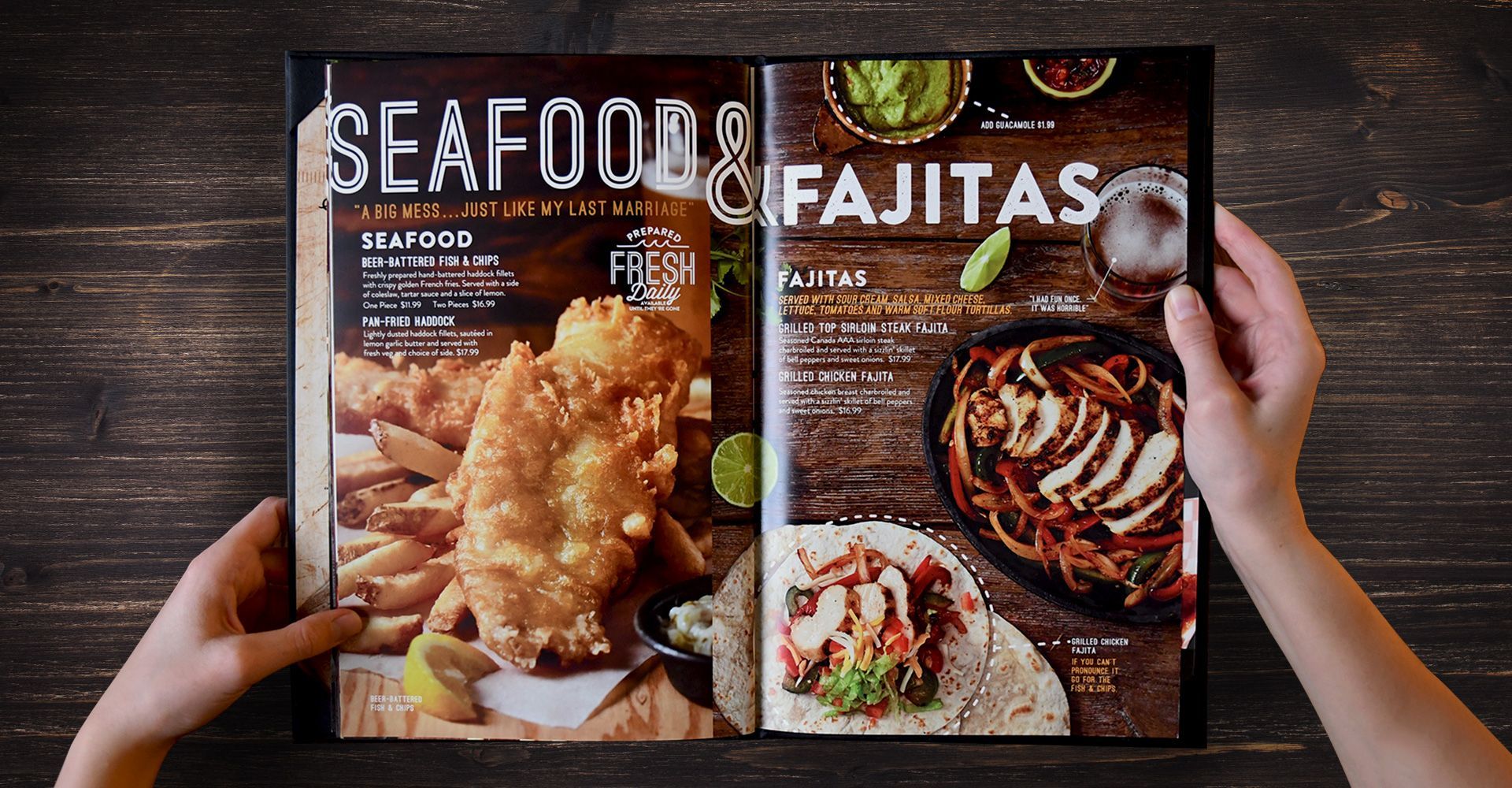 A person is holding a menu for seafood and fajitas