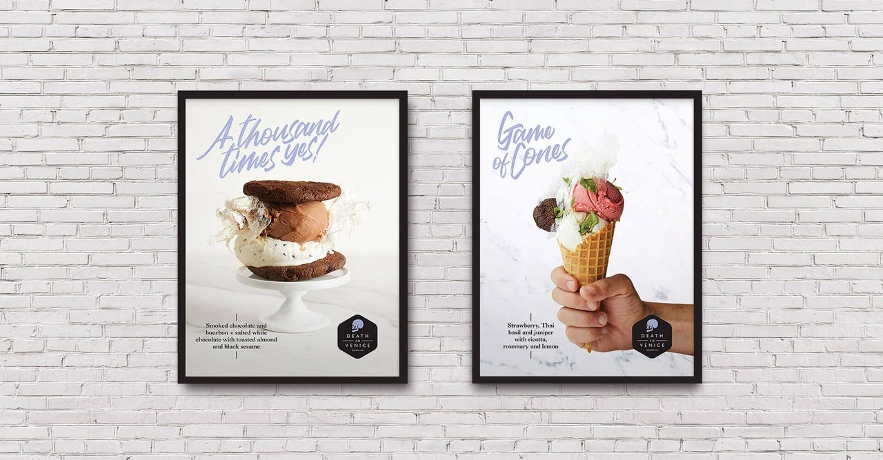 Two posters are hanging on a white brick wall.