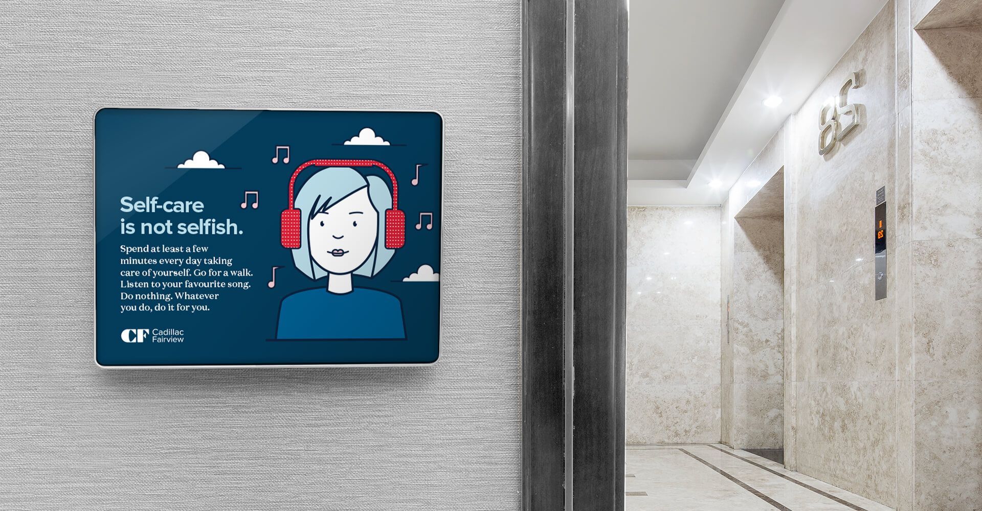 A sign on a wall with a picture of a woman wearing headphones.