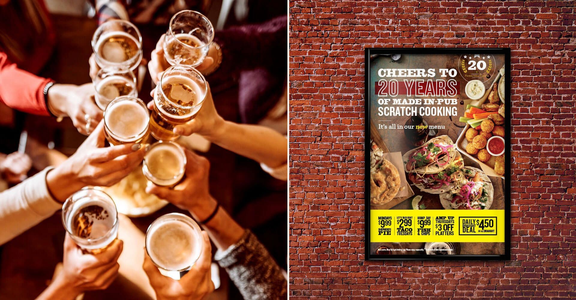 A group of people are toasting with beer glasses in front of a brick wall.