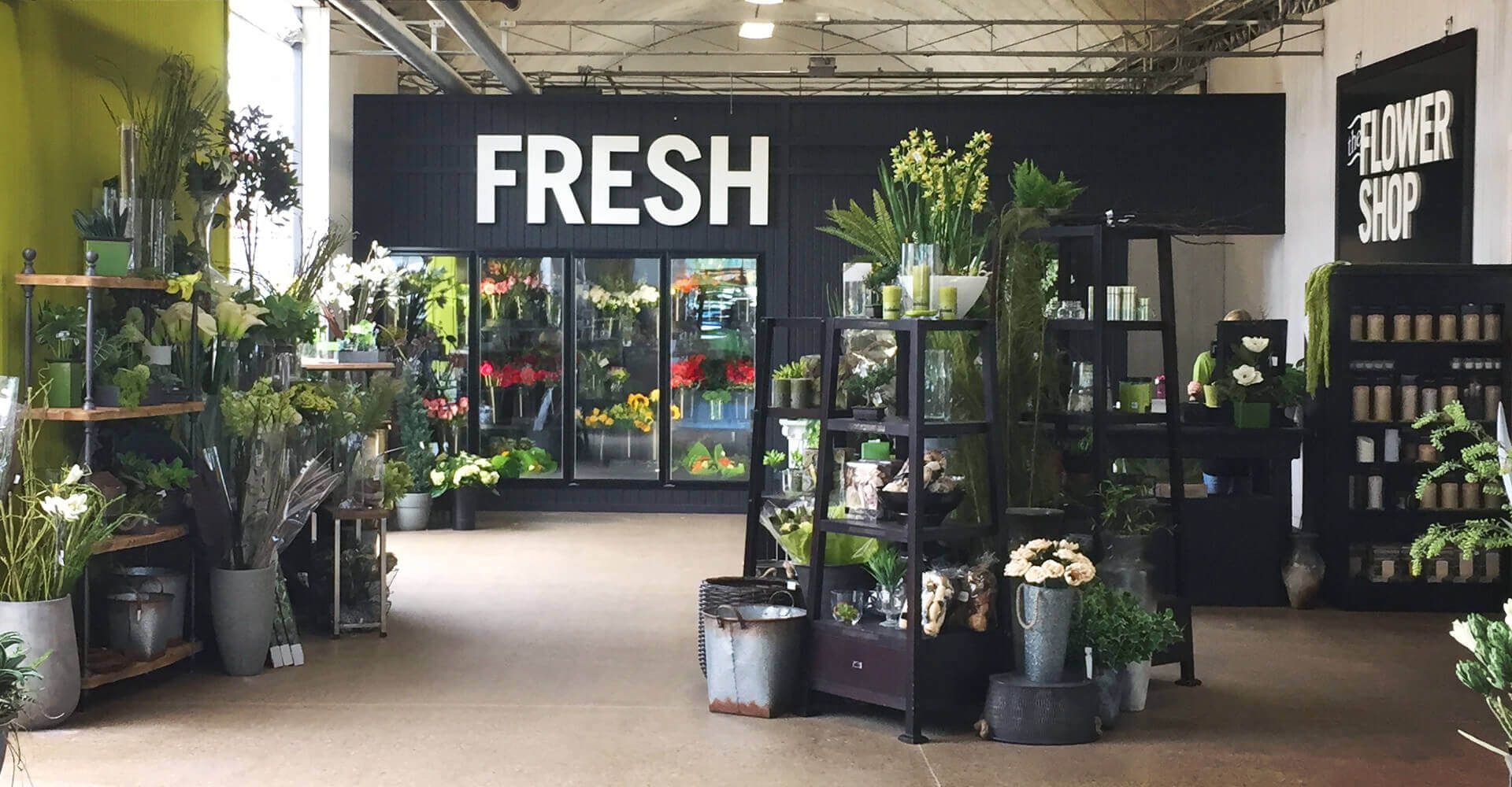 A store with a sign that says fresh on it