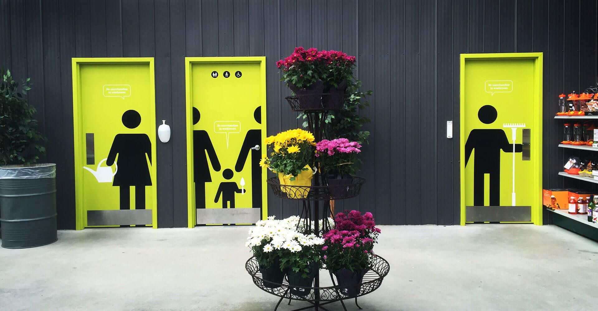 A row of yellow doors with silhouettes of people on them
