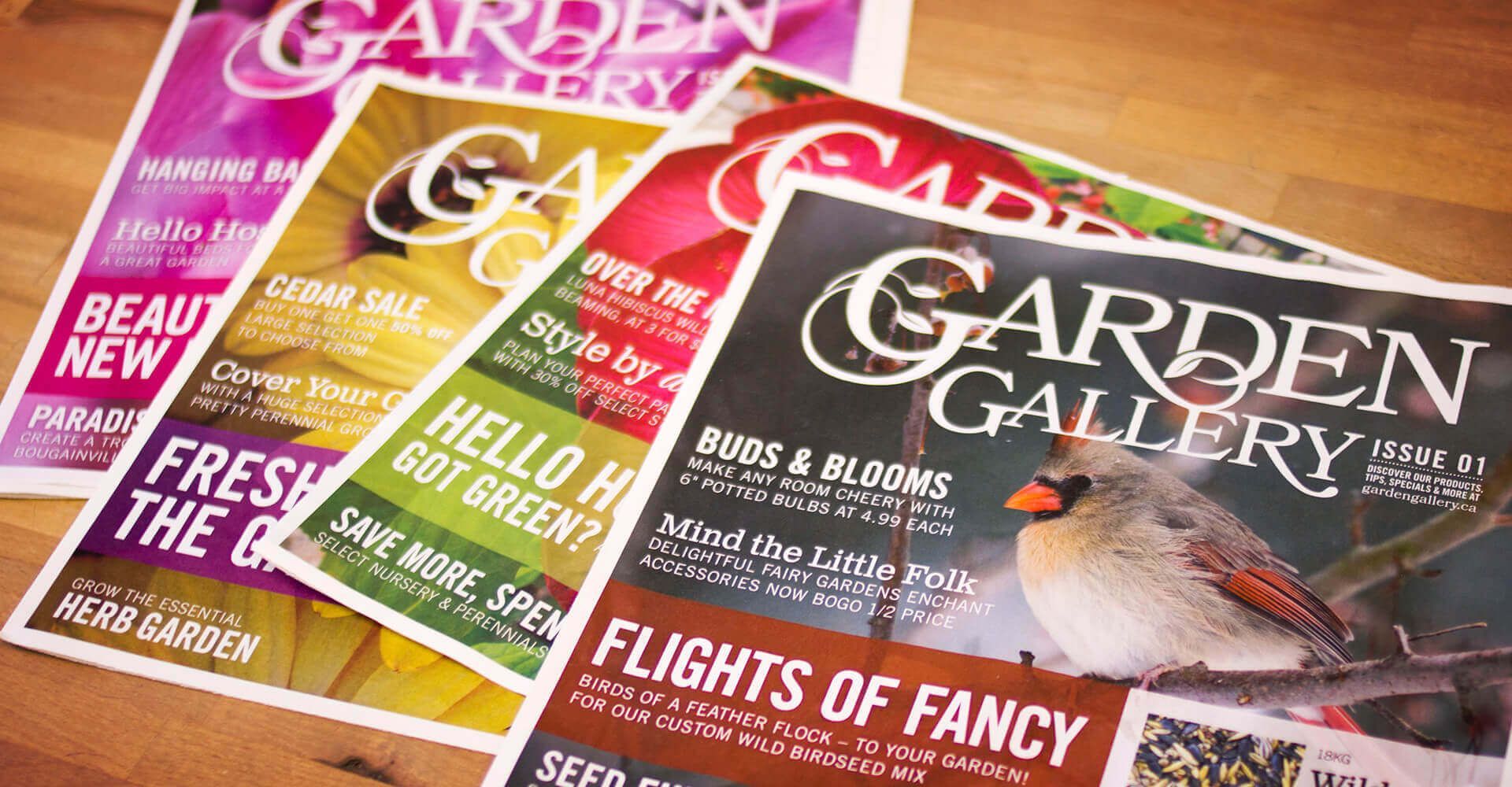 Four garden gallery magazines are stacked on top of each other