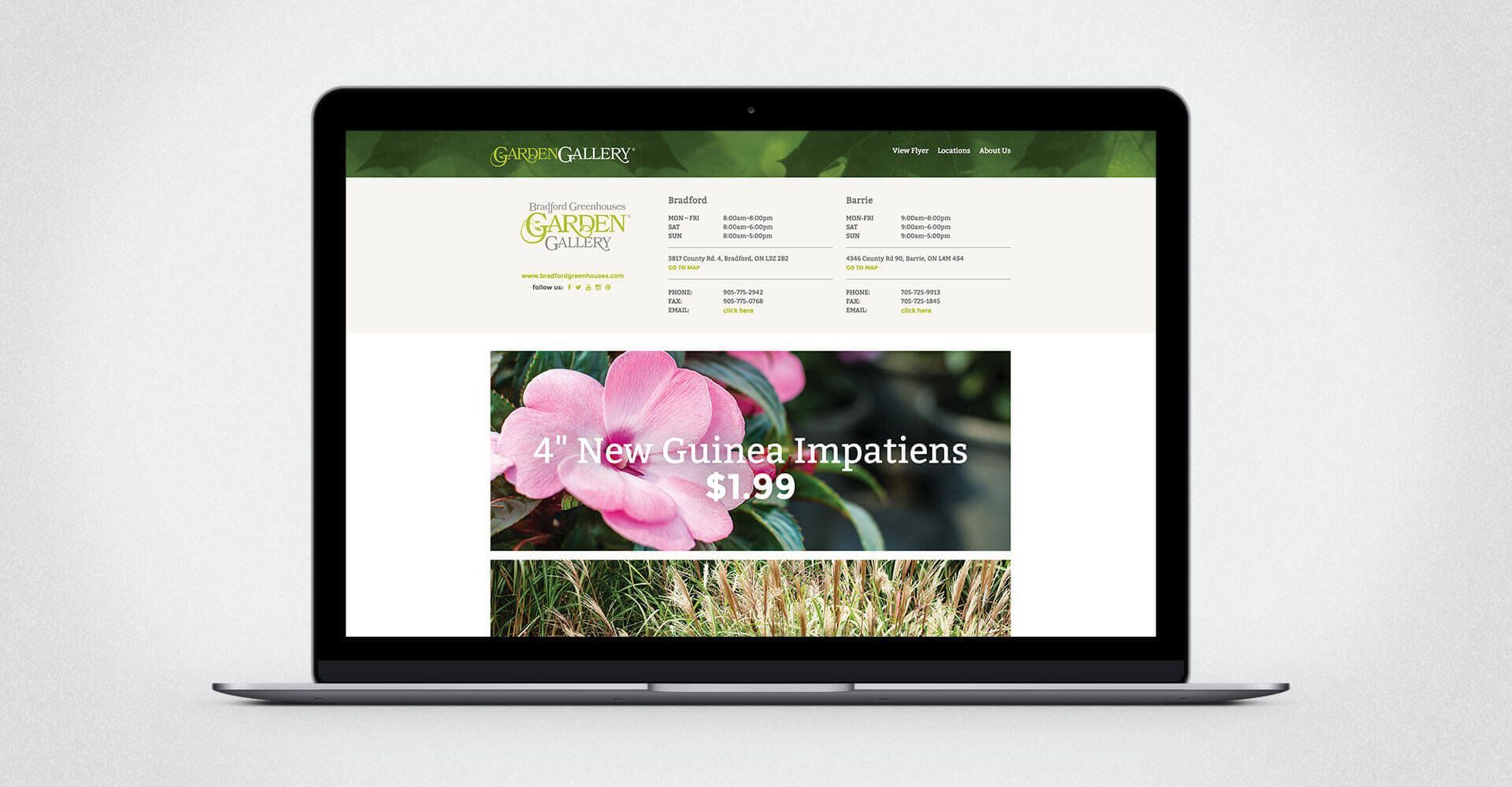 A laptop computer is open to a website with a pink flower on the screen.