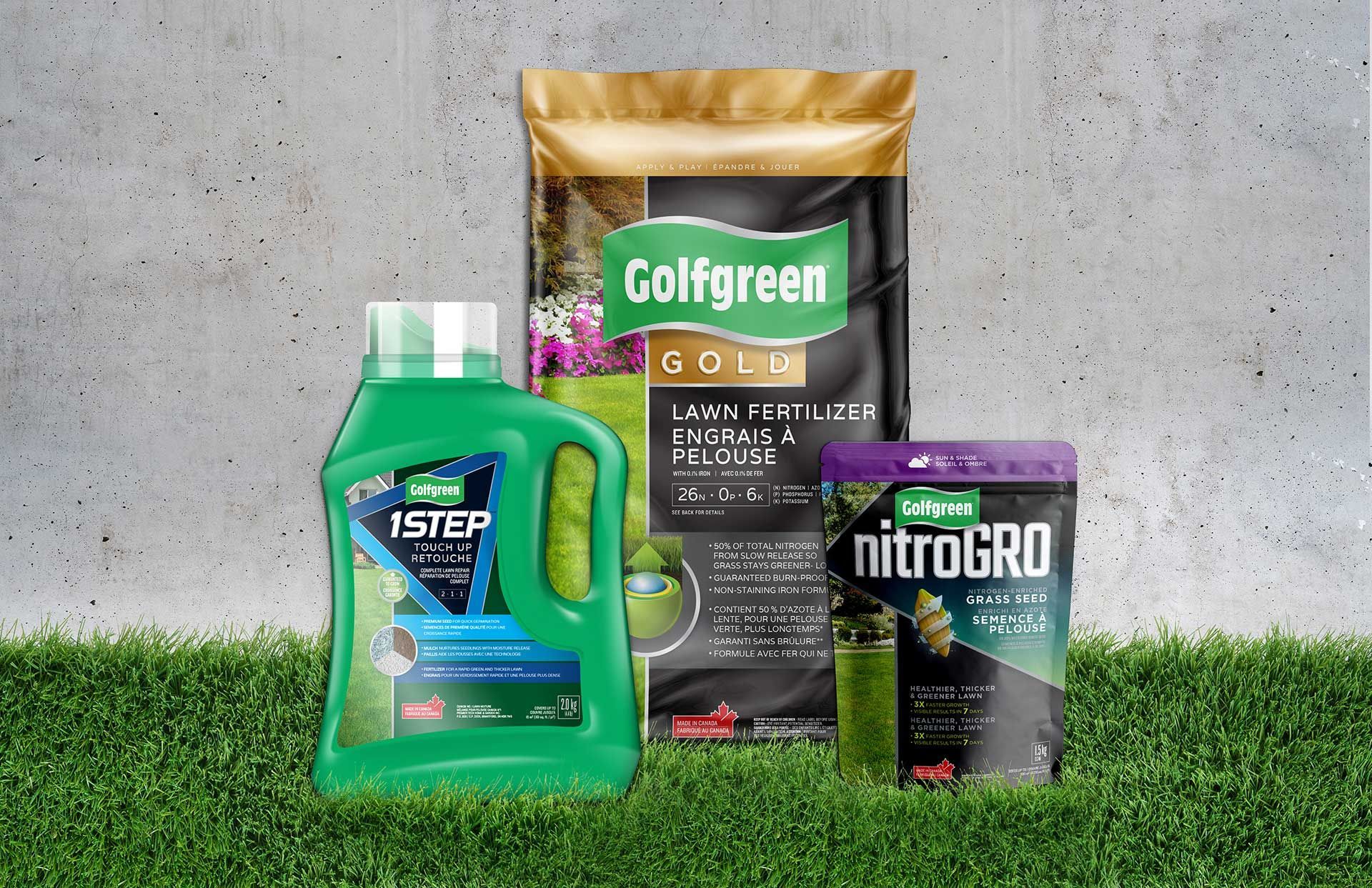 A bottle of golfgreen fertilizer is sitting on top of a lush green lawn.