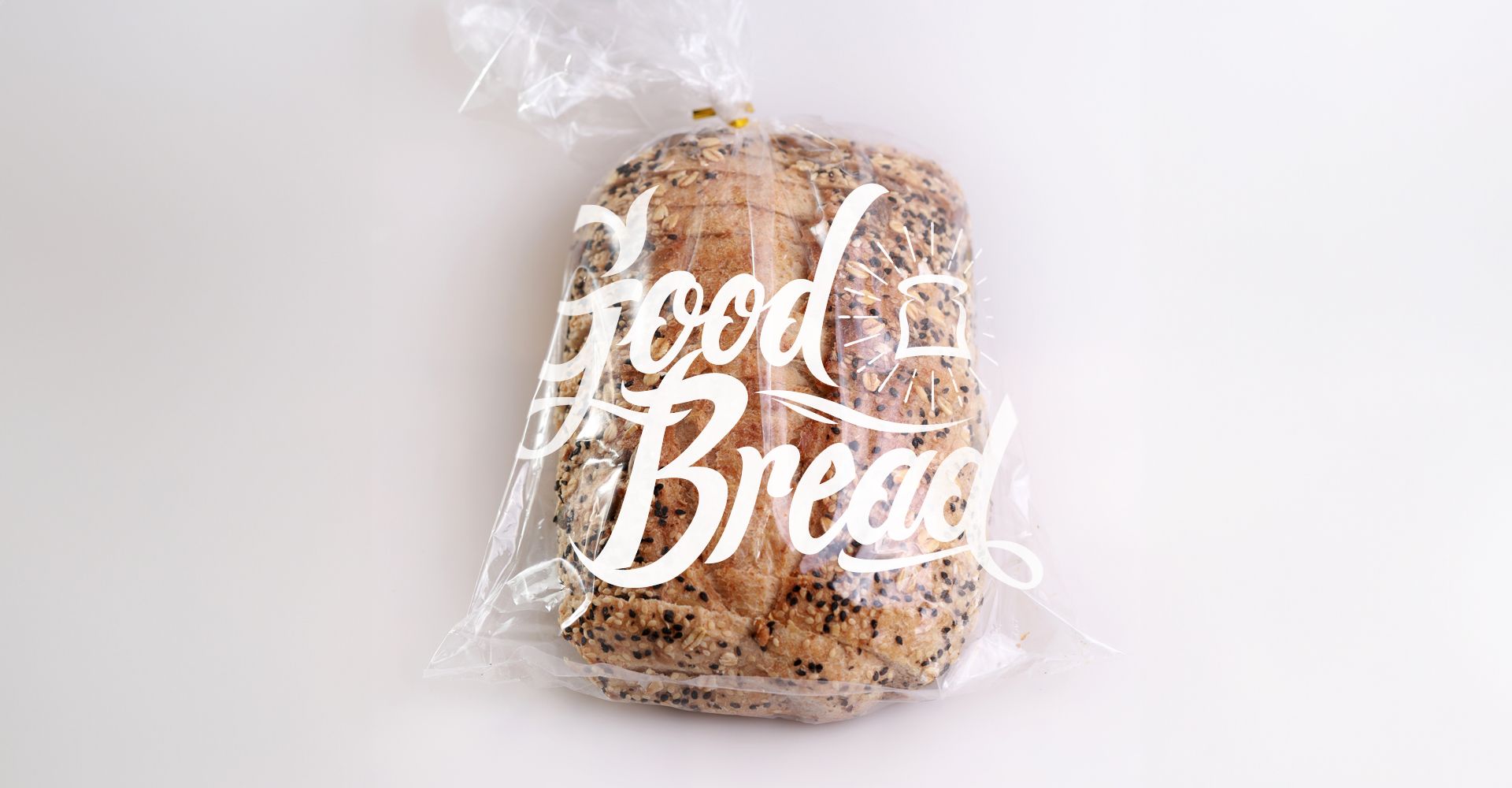 A loaf of bread in a plastic bag with the words `` good bread '' written on it.