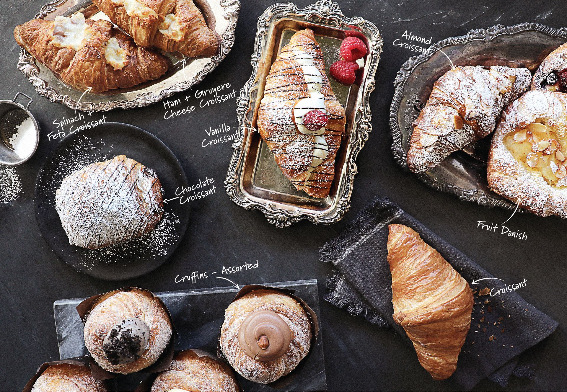 A variety of pastries and croissants on a table