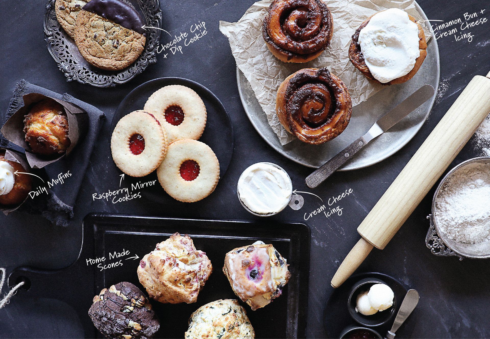 A table topped with a variety of pastries and a rolling pin