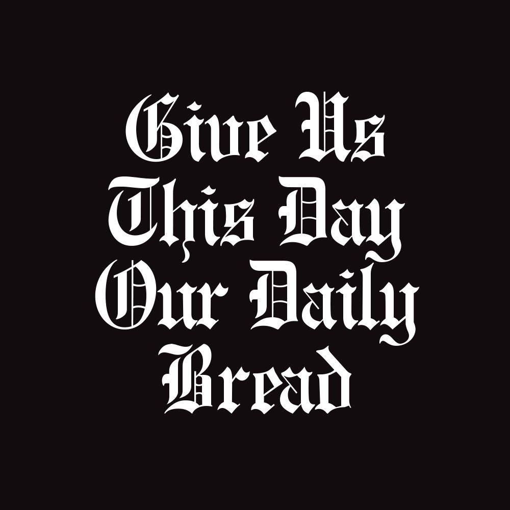 A black background with white text that says give us this day our daily bread