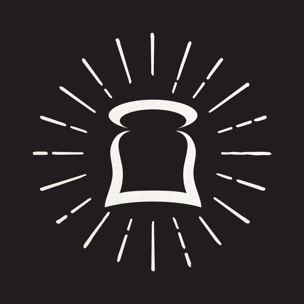 A slice of bread with rays coming out of it on a black background.