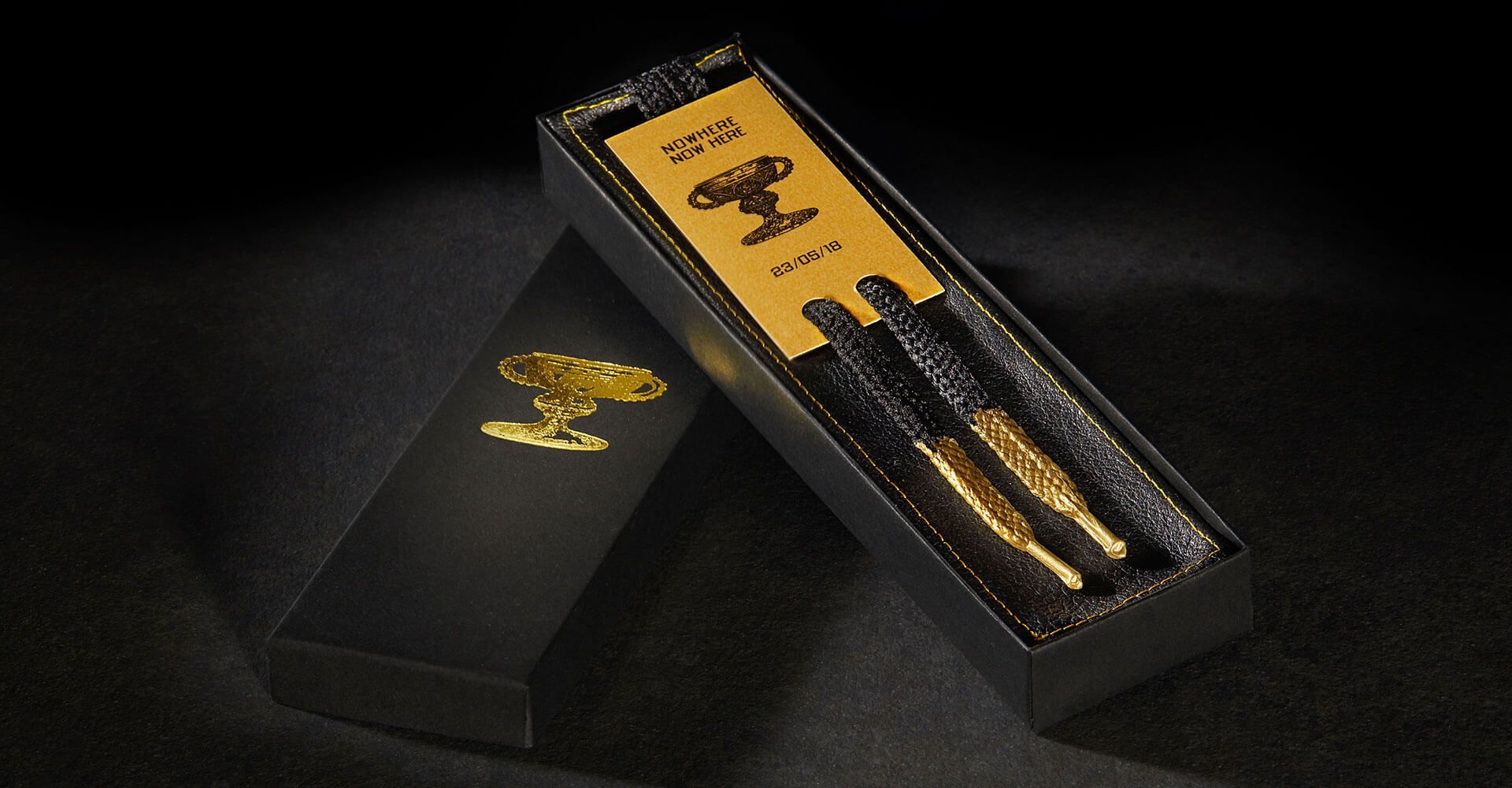 A black box with gold writing on it