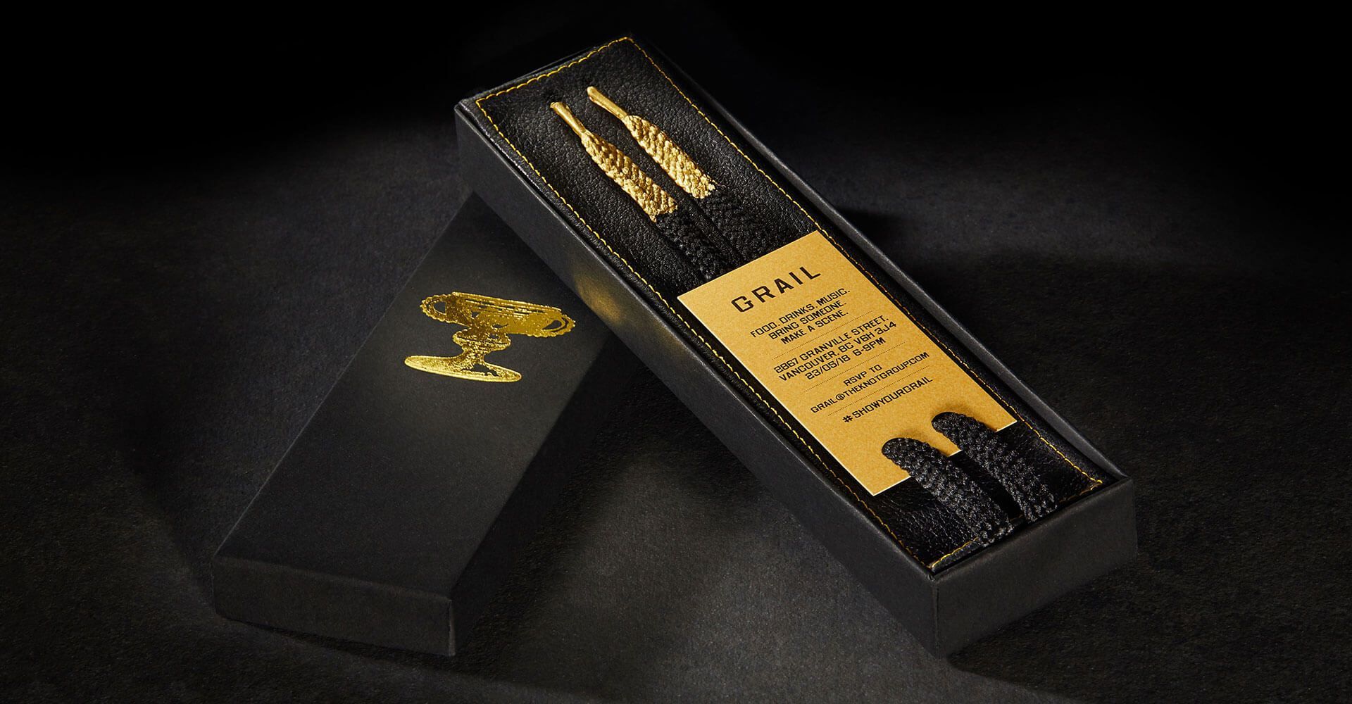 A black box with a gold label that says chris