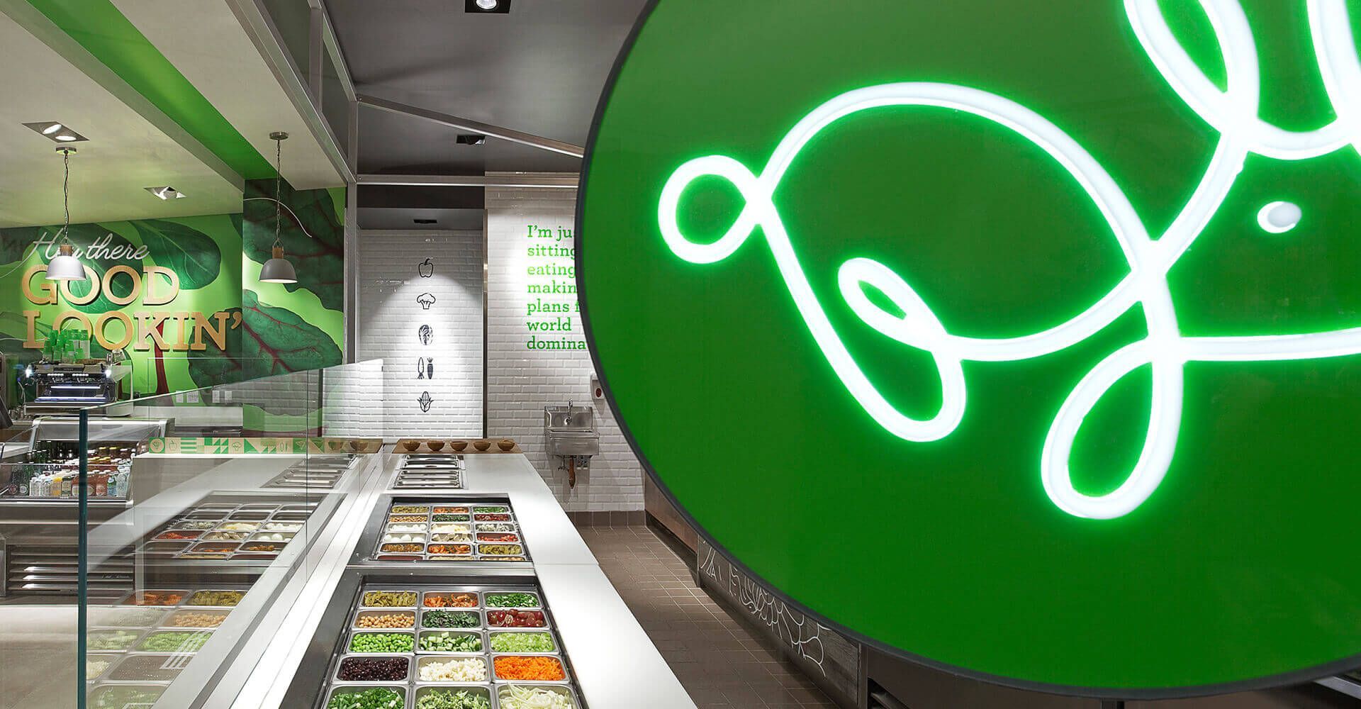 A green sign with a rabbit on it is in a restaurant.