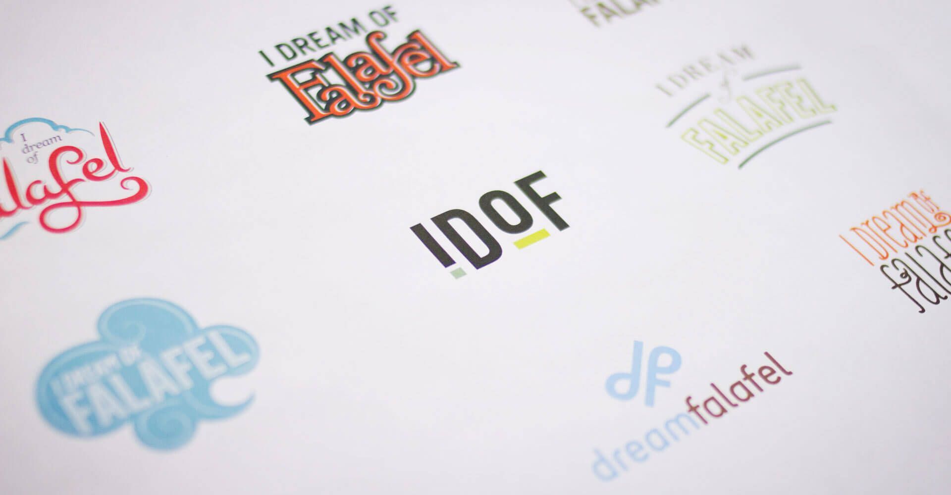 A bunch of logos are laying on a white surface.