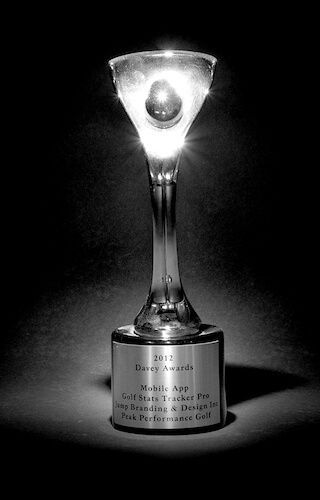 A black and white photo of a trophy with a light inside of it.