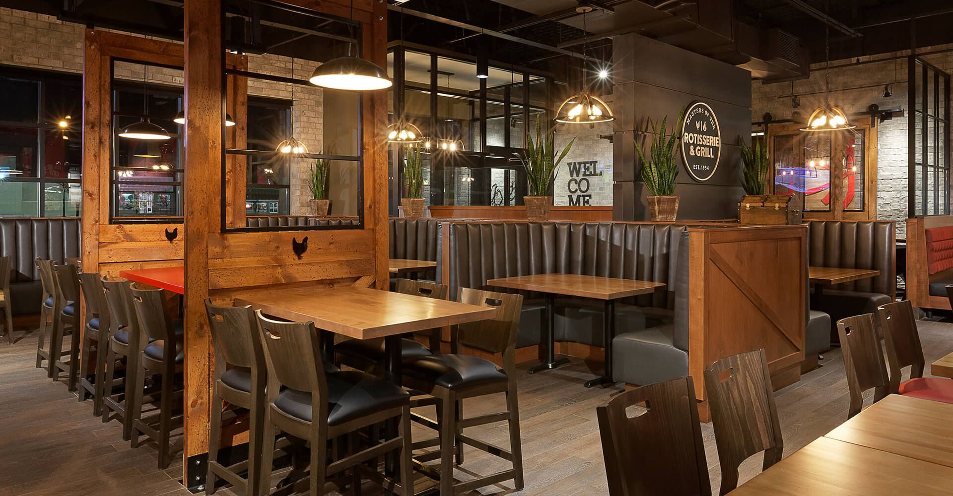 A dining room with tables and chairs in a restaurant.