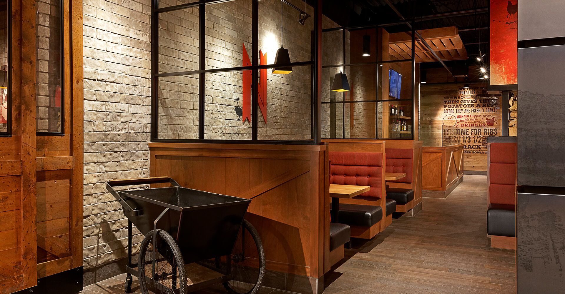 A restaurant with a wheelbarrow in the middle of it