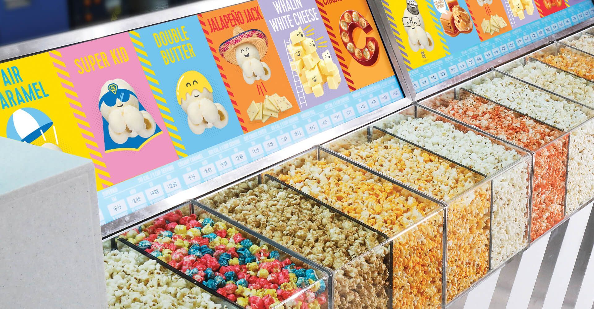 A display case filled with lots of different types of popcorn.