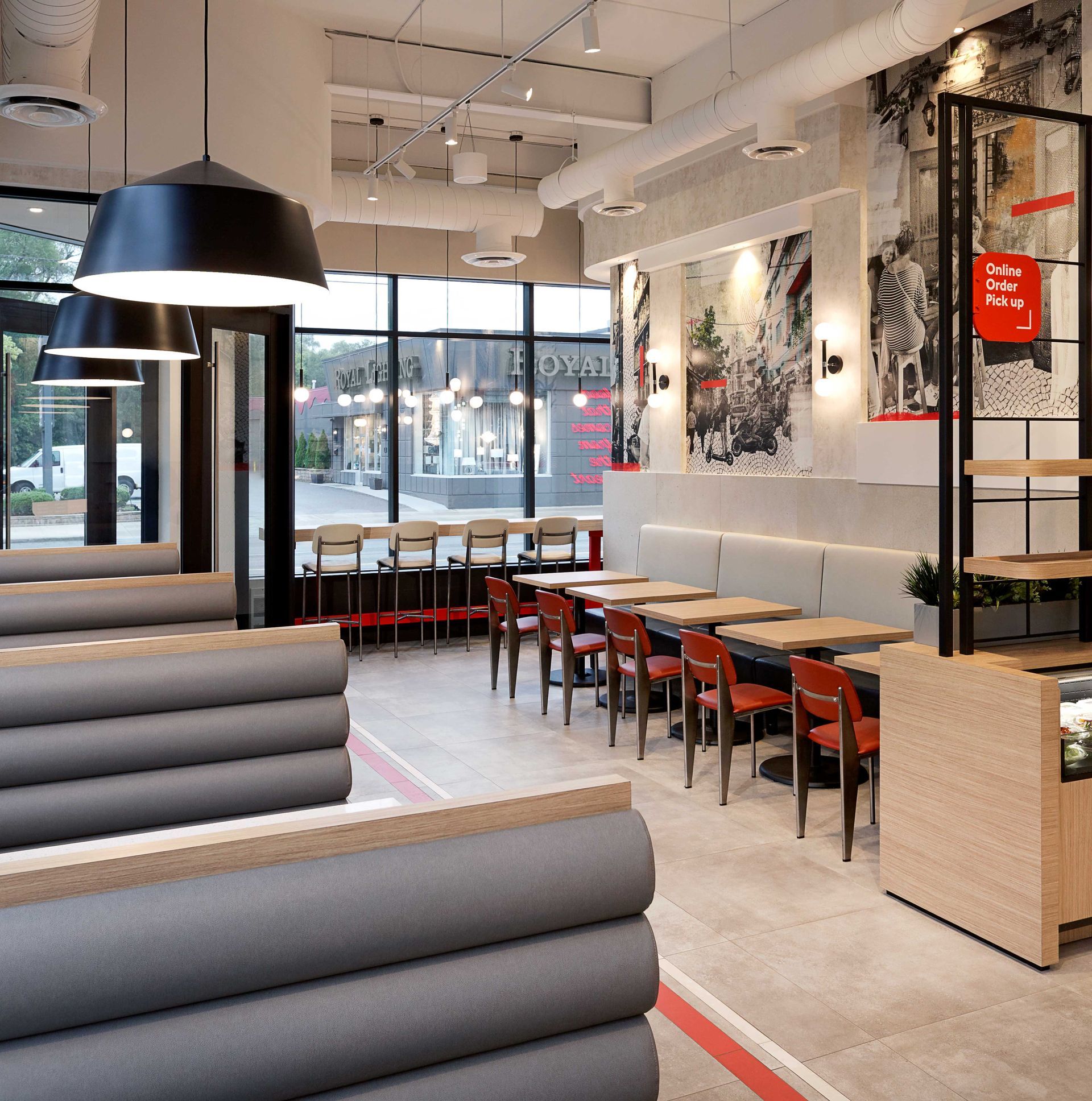 The inside of a restaurant with tables and chairs